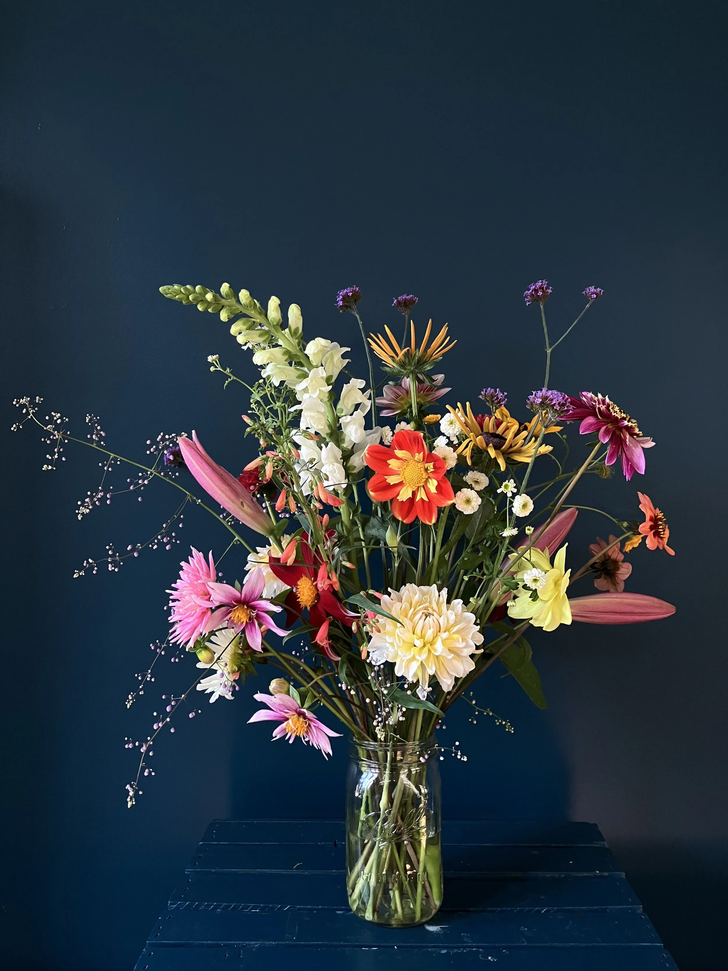 A custom design of lilies and snapdragons with splashy seasonal dahlias made as a NE Portland gift for home