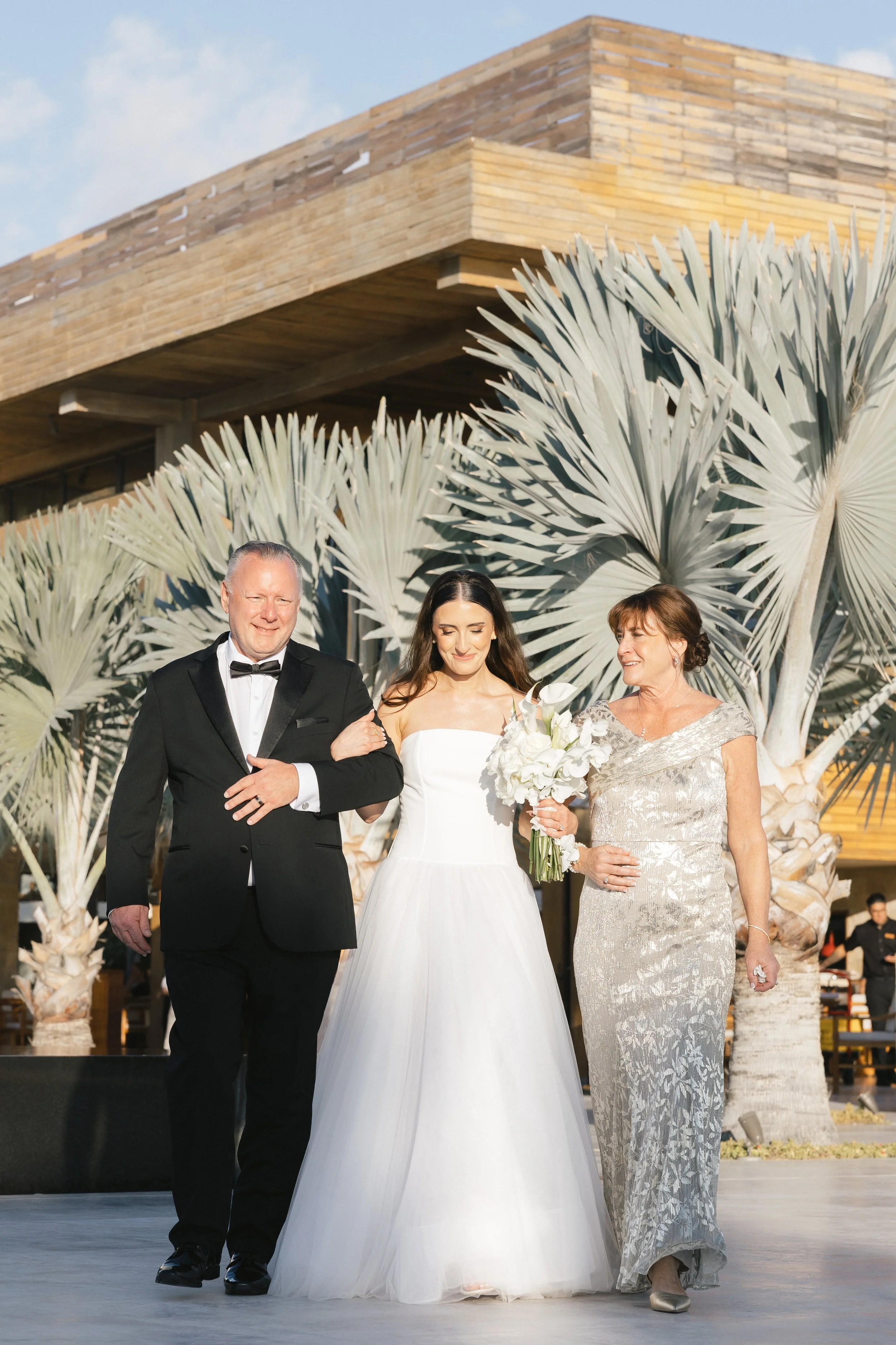 bride walking down the aisle at nobu los cabos