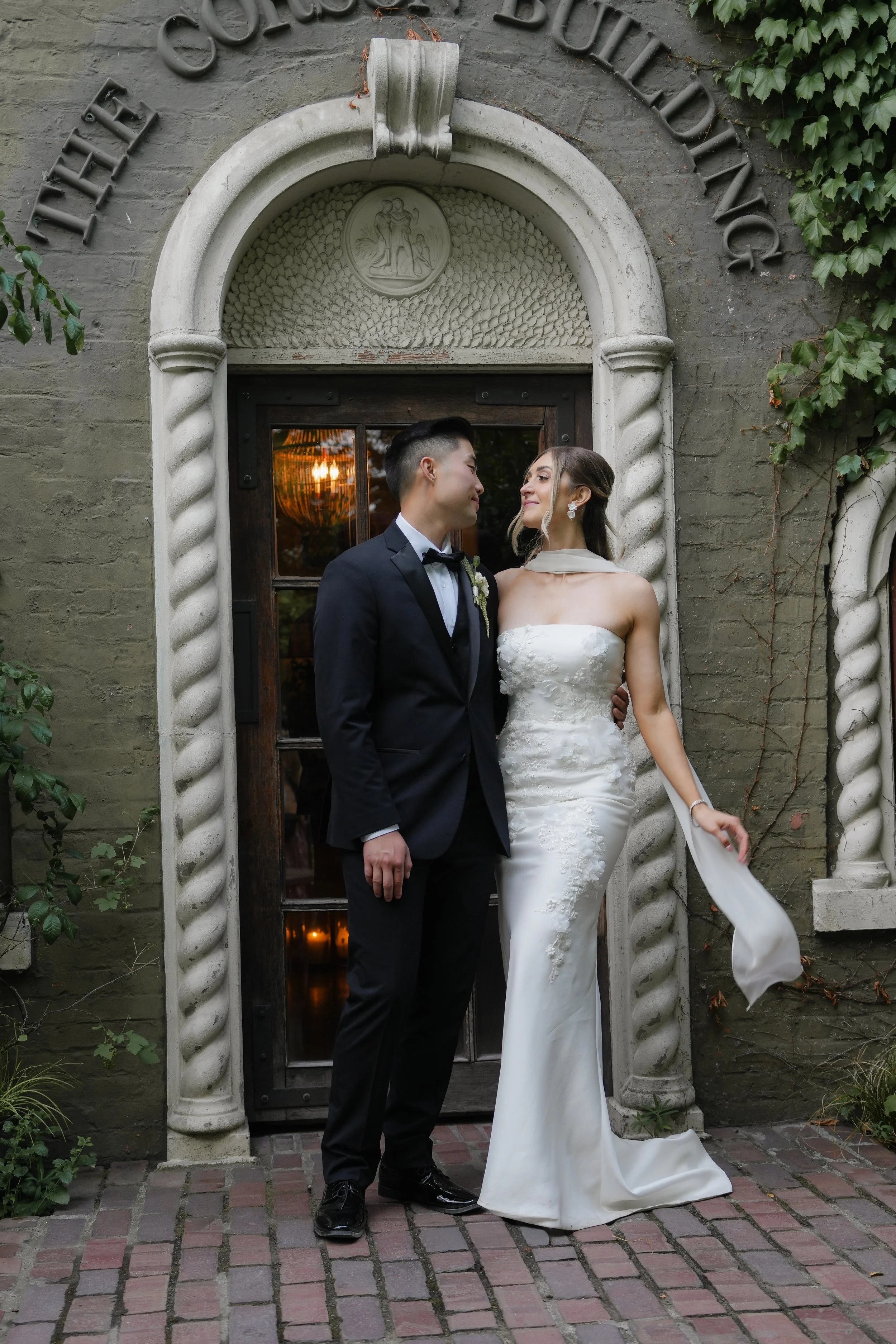 high-fashion bride and groom at the corson building wedding venue