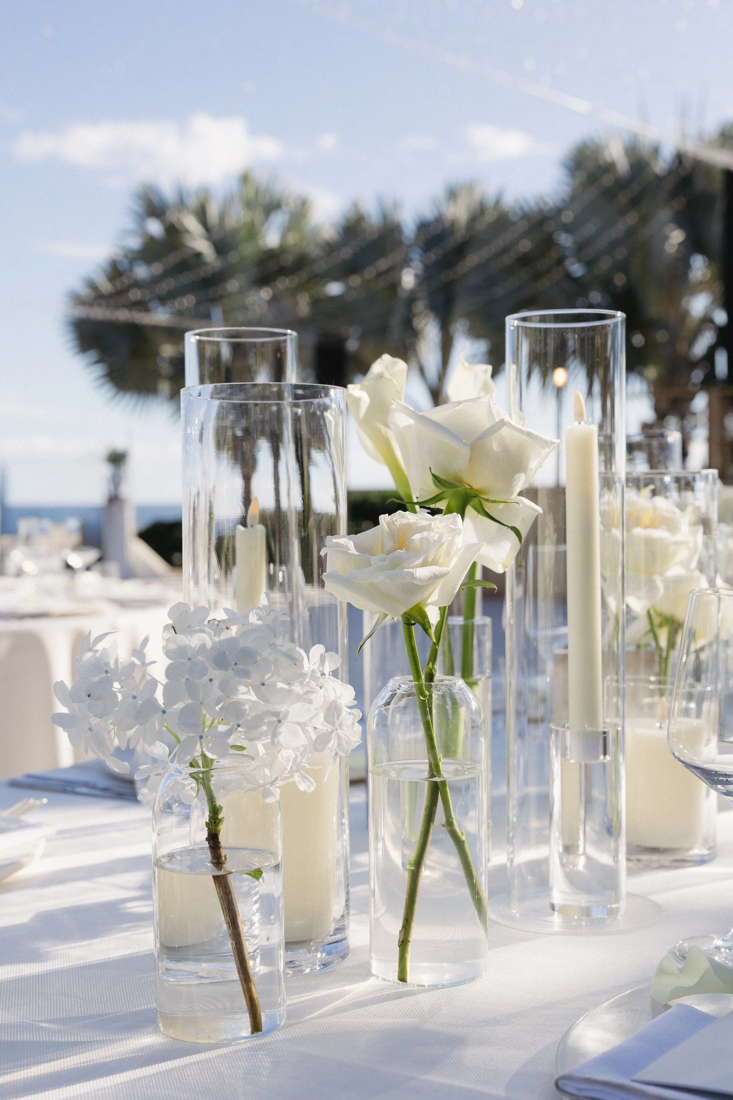 luxury wedding tablescape at beachside resort in mexico with white roses