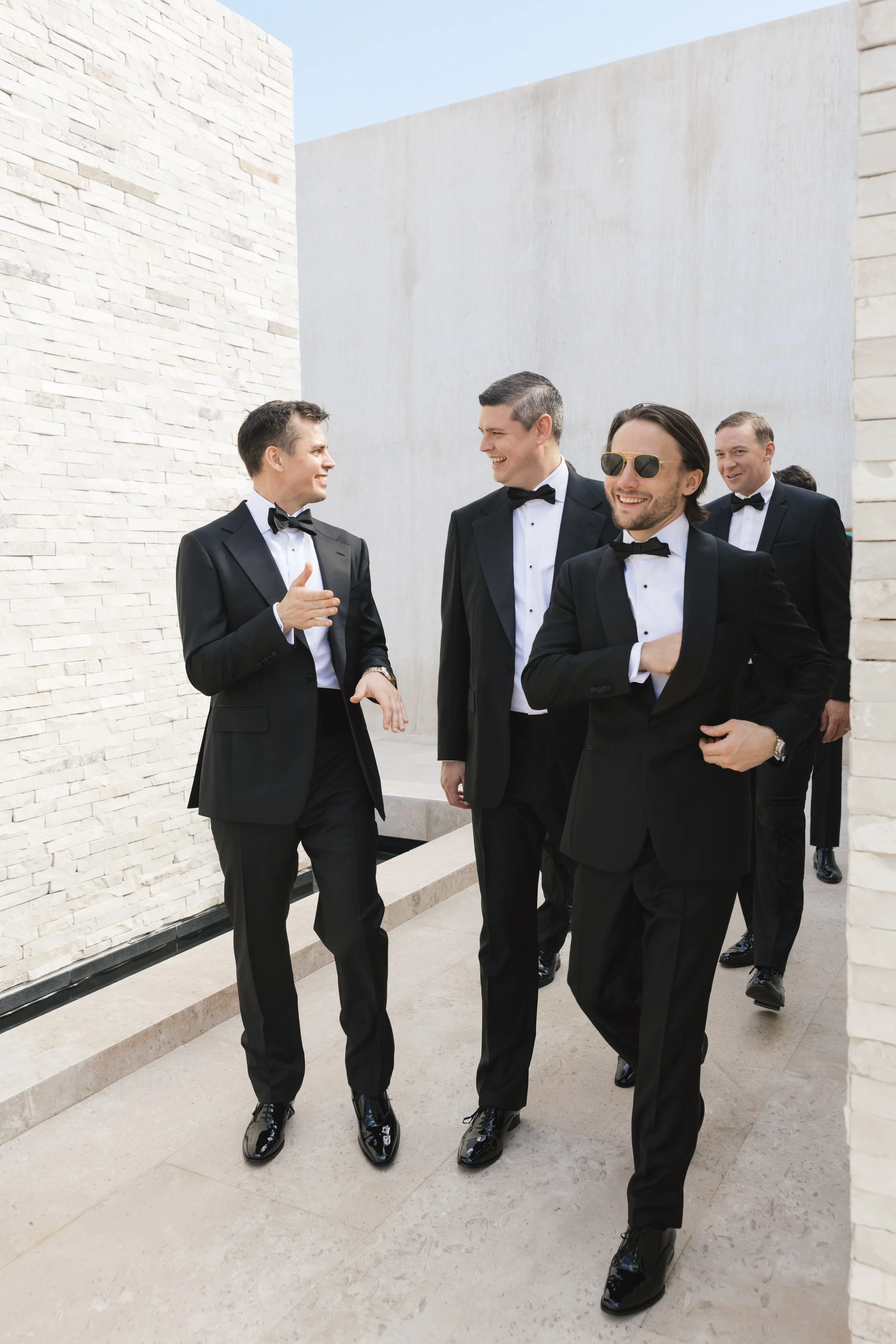 groom with wedding party at destination wedding in cabo