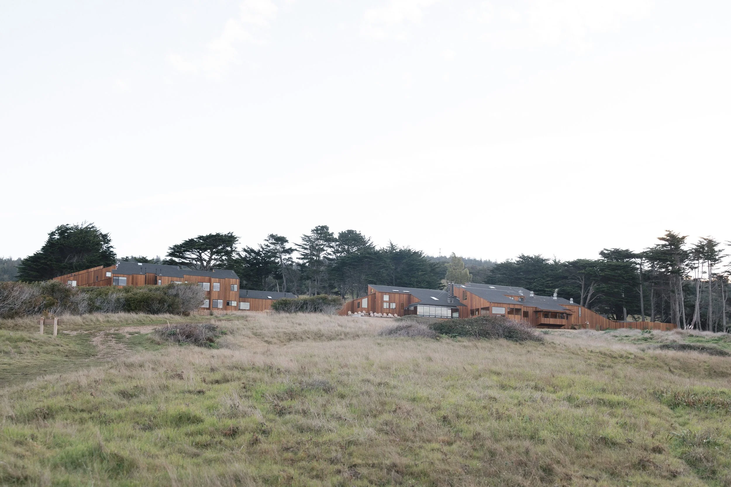 sea ranch lodge perched above the pacific ocean with expansive coastal views