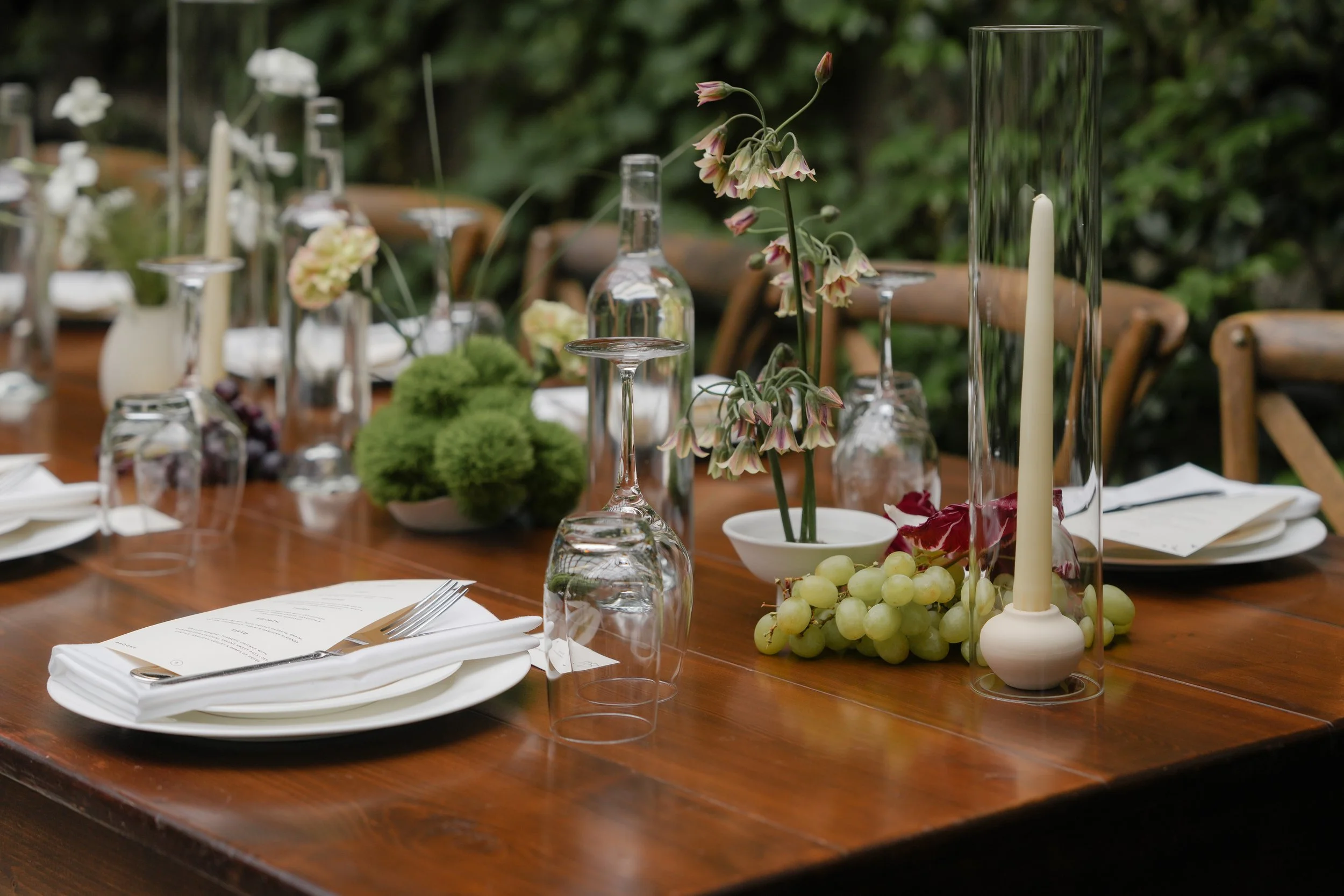 curated wedding table scape with grapes and cabbage accents
