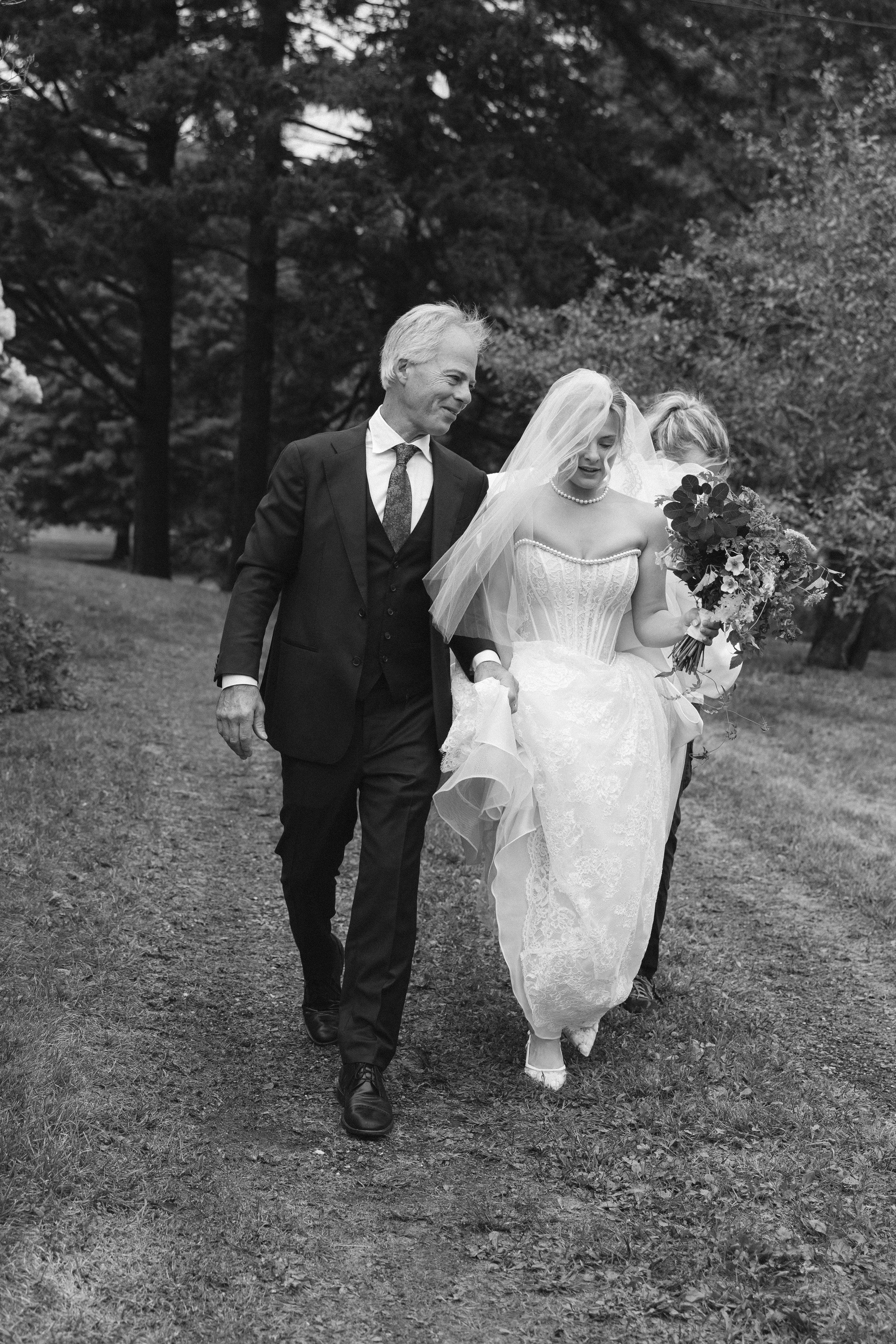 documentary photography bride walking down aisle in the berkshires at luxury wedding