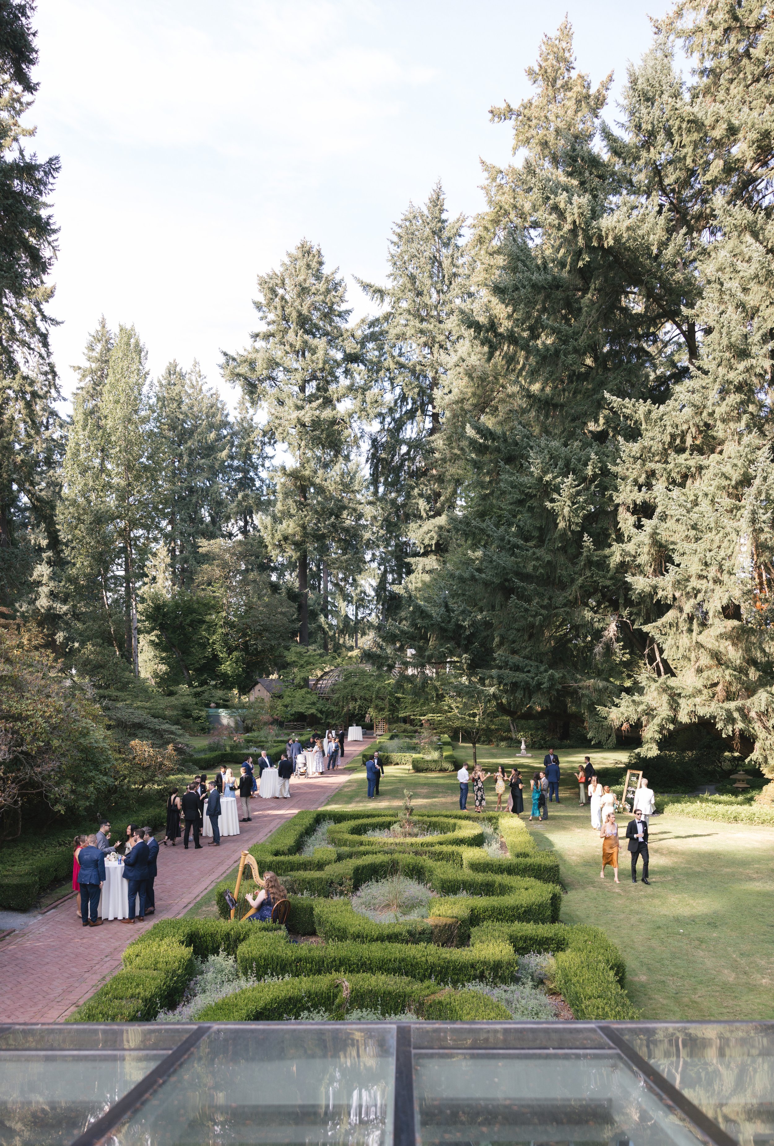 luxury wedding outdoor garden cocktail hour with harpist