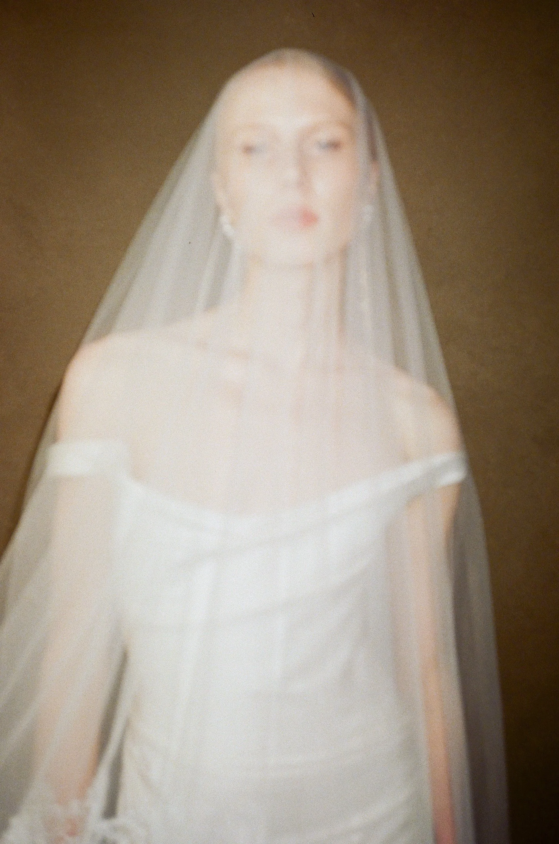 editorial vivienne westwood wedding dress on bride with blusher veil