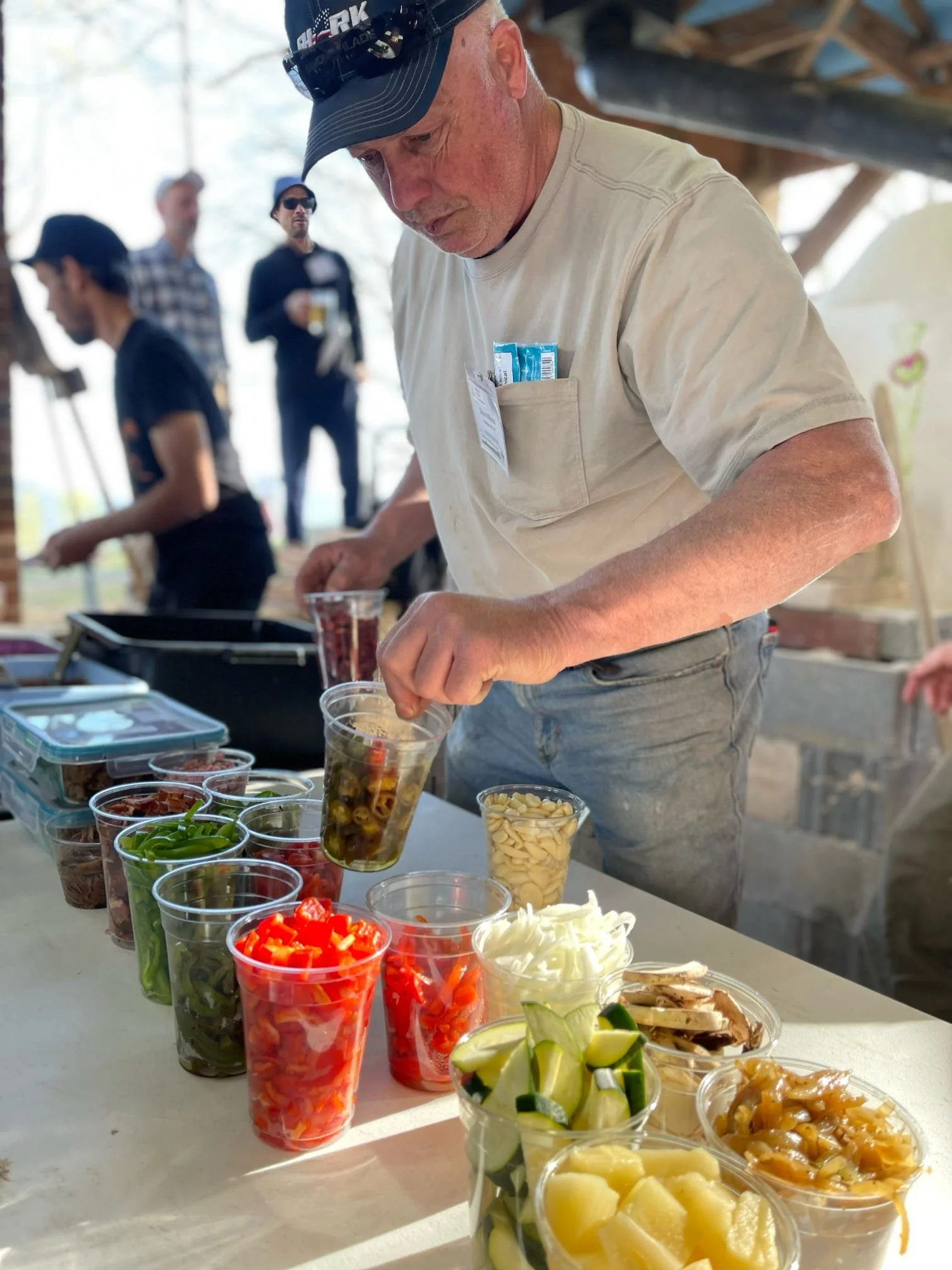 Dave's getting toppings ready to go
