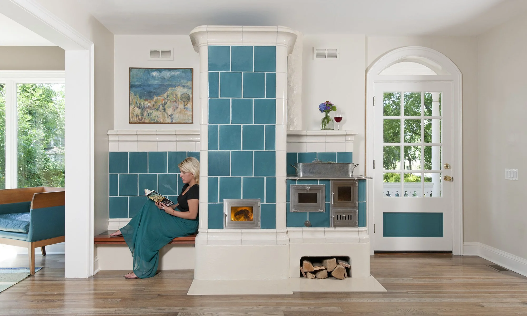 Woman reclining on teal fireplace