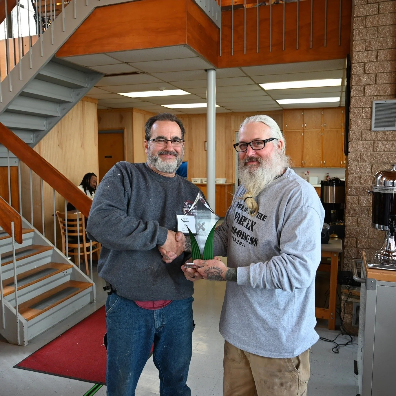 MHA President giving award to another member