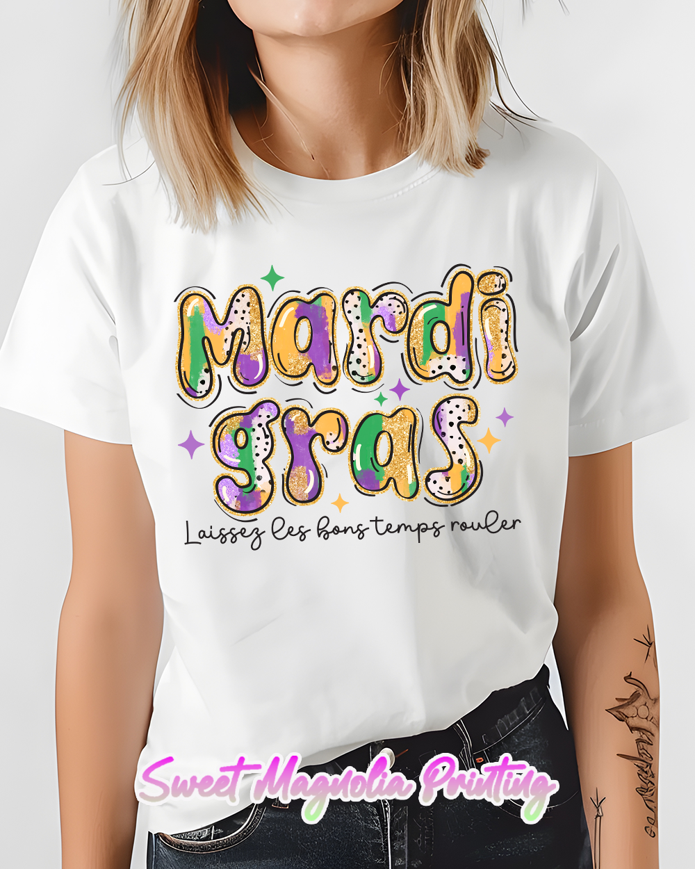 Colorful Mardi Gras shirt featuring vibrant designs, celebrating the festive spirit of Mardi Gras by Sweet Magnolia Printing | Mardi Gras Shirt | Sweet Magnolia Printing