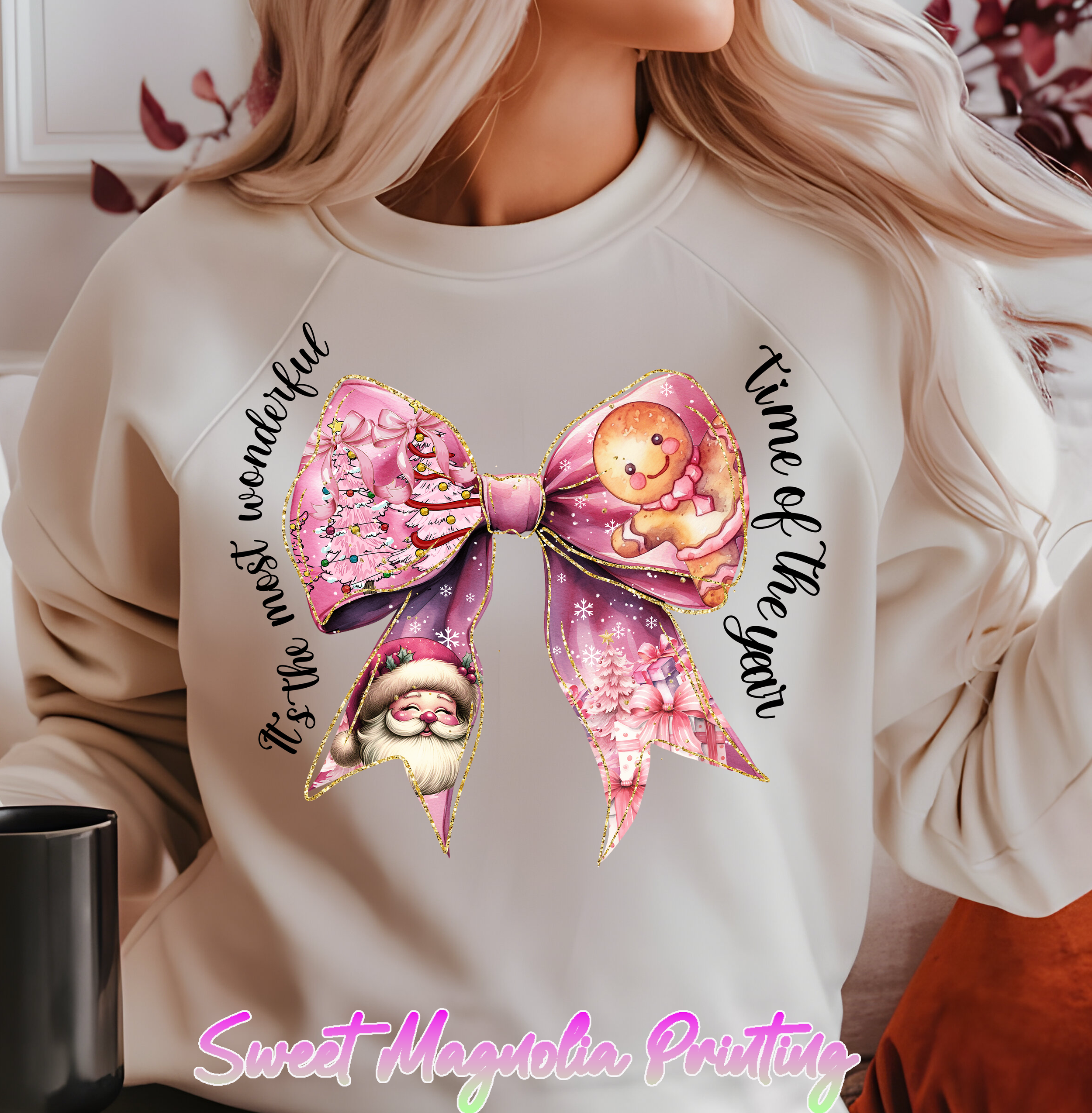 A festive pink bow with illustrations of Christmas trees, a gingerbread figure, Santa Claus, and wrapped gifts, all bordered in gold | Christmas Transfer | Sweet Magnolia Printing