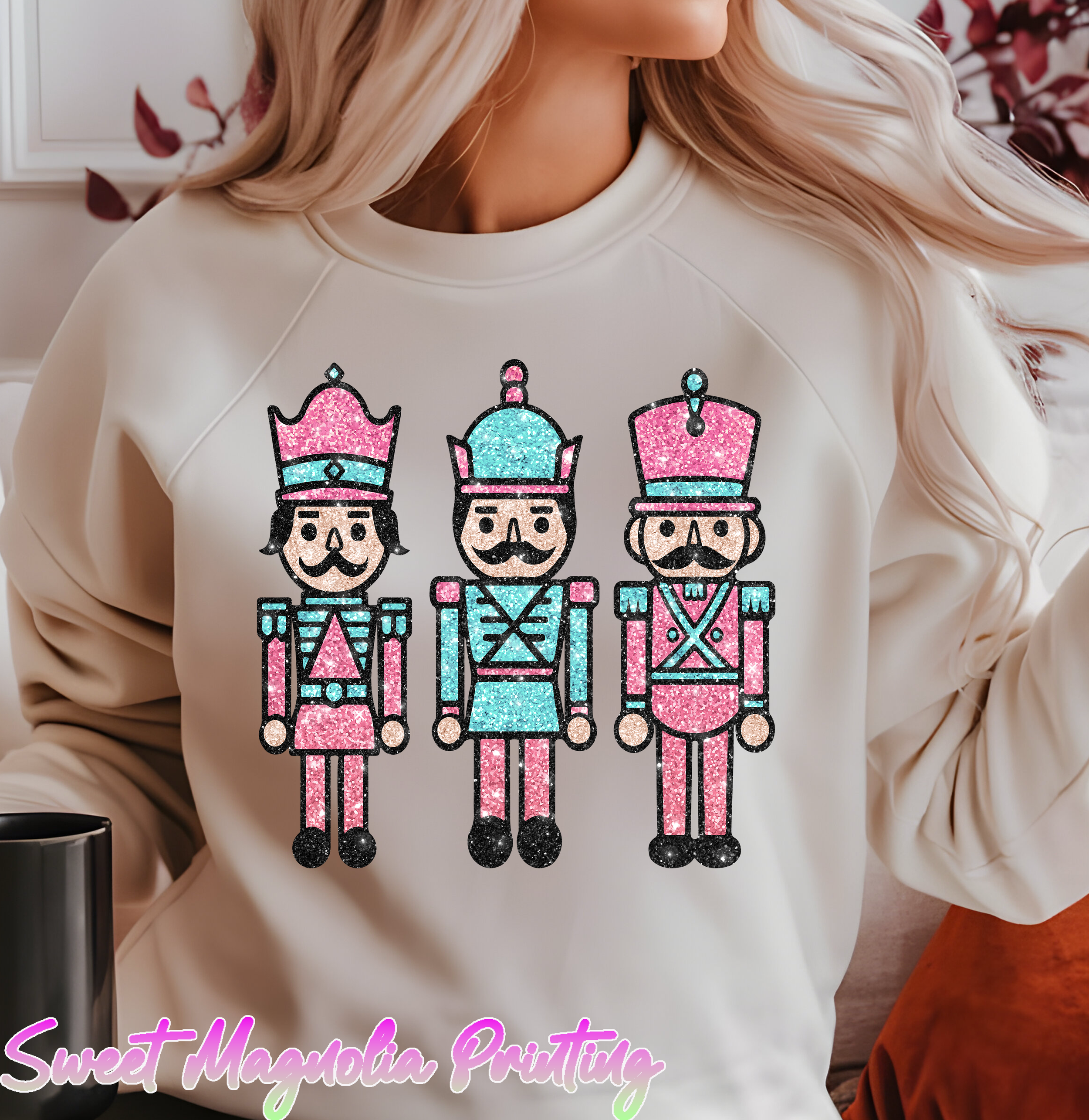 Three amusing nutcracker figures, embellished with glitter, wearing colorful hats and uniforms in pink and blue tones. | Christmas DTF Transfer | Sweet Magnolia Printing