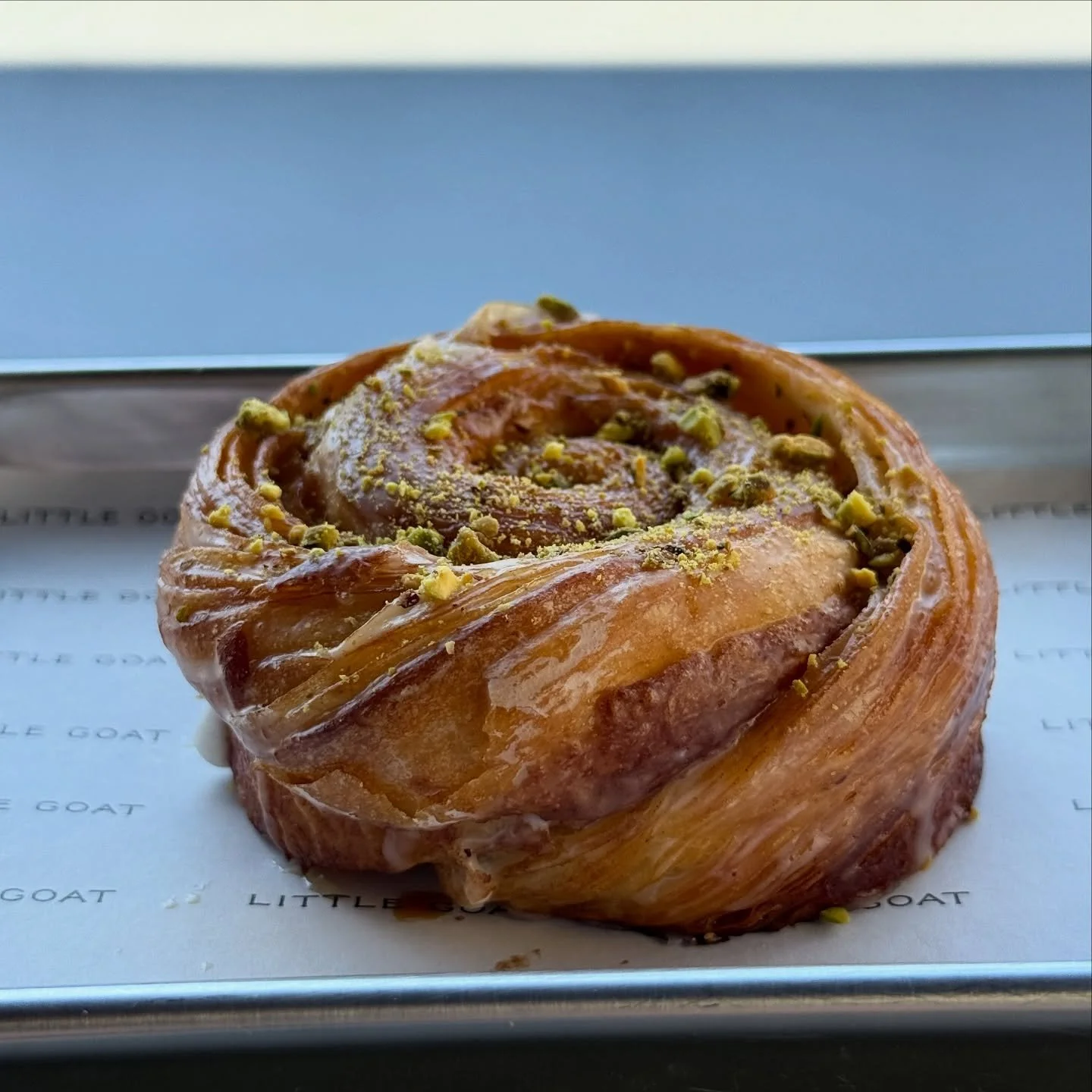 Meet the Pistachio + Cardamom Morning Bun!!

This is one of our seasonal pastries hitting the bakery counter this week!! Our Pistachio + Cardamom Mornings Buns are made with croissant dough that takes three days to prepare. We roll the dough with car