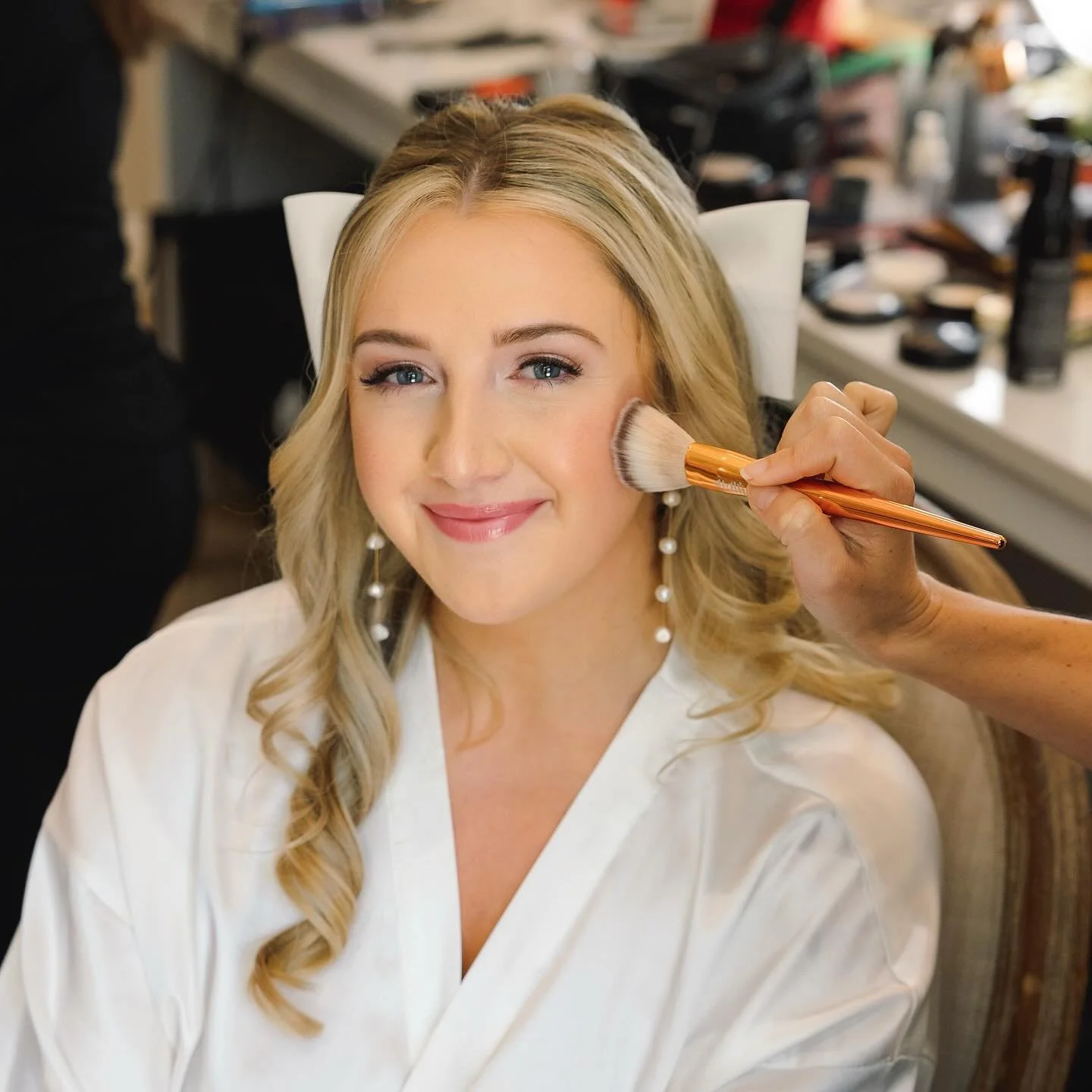 Thinking back to this lovely bride who got married back in spring.  What a treat it was to work with her and her bridal party. 
This bride had a fun idea to put a bow in her hair with the fabric made out of her wedding dress! 
I love when brides have