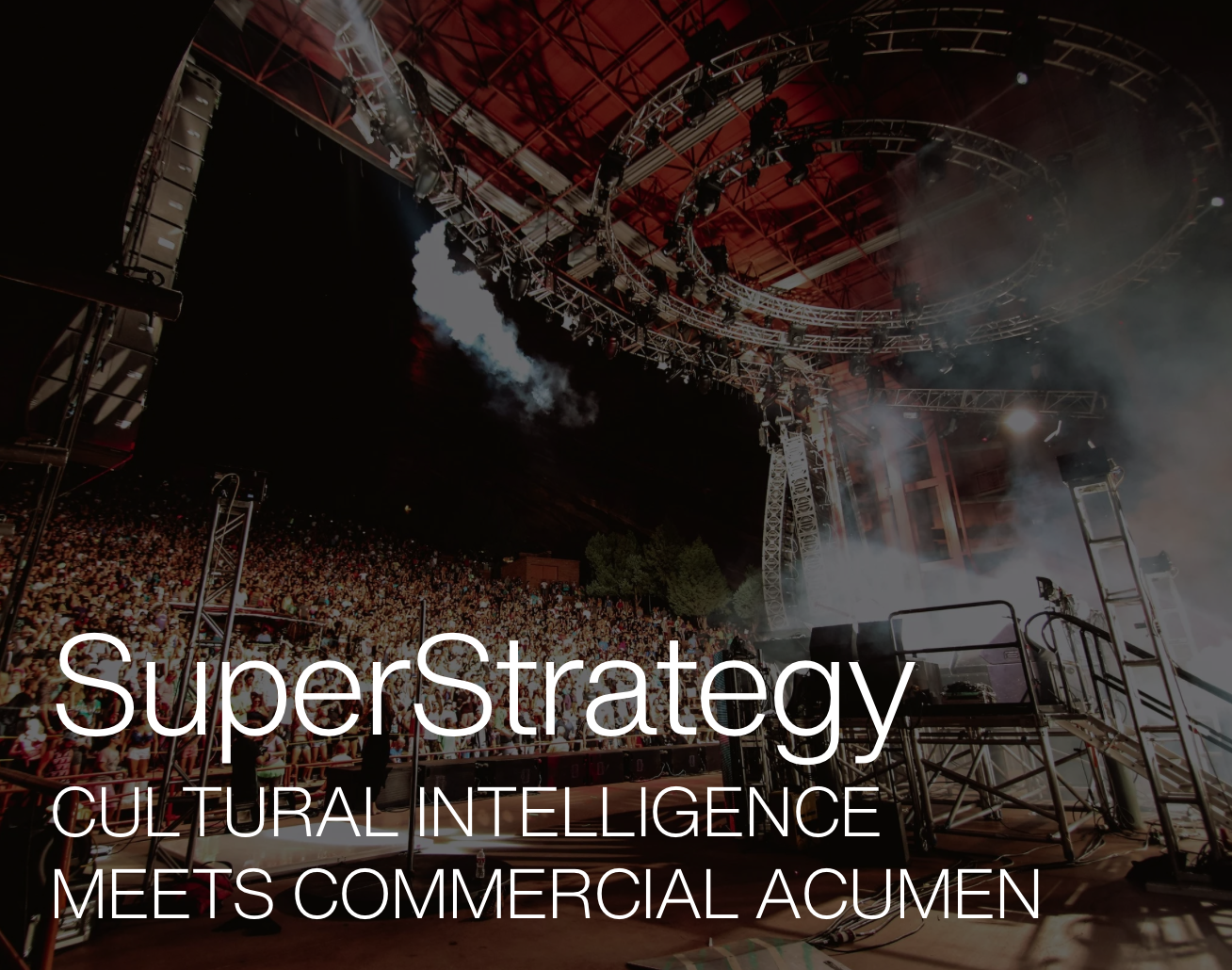 Concert stage with lights and large crowd, featuring text 'SuperStrategy: Cultural Intelligence Meets Commercial Acumen'."