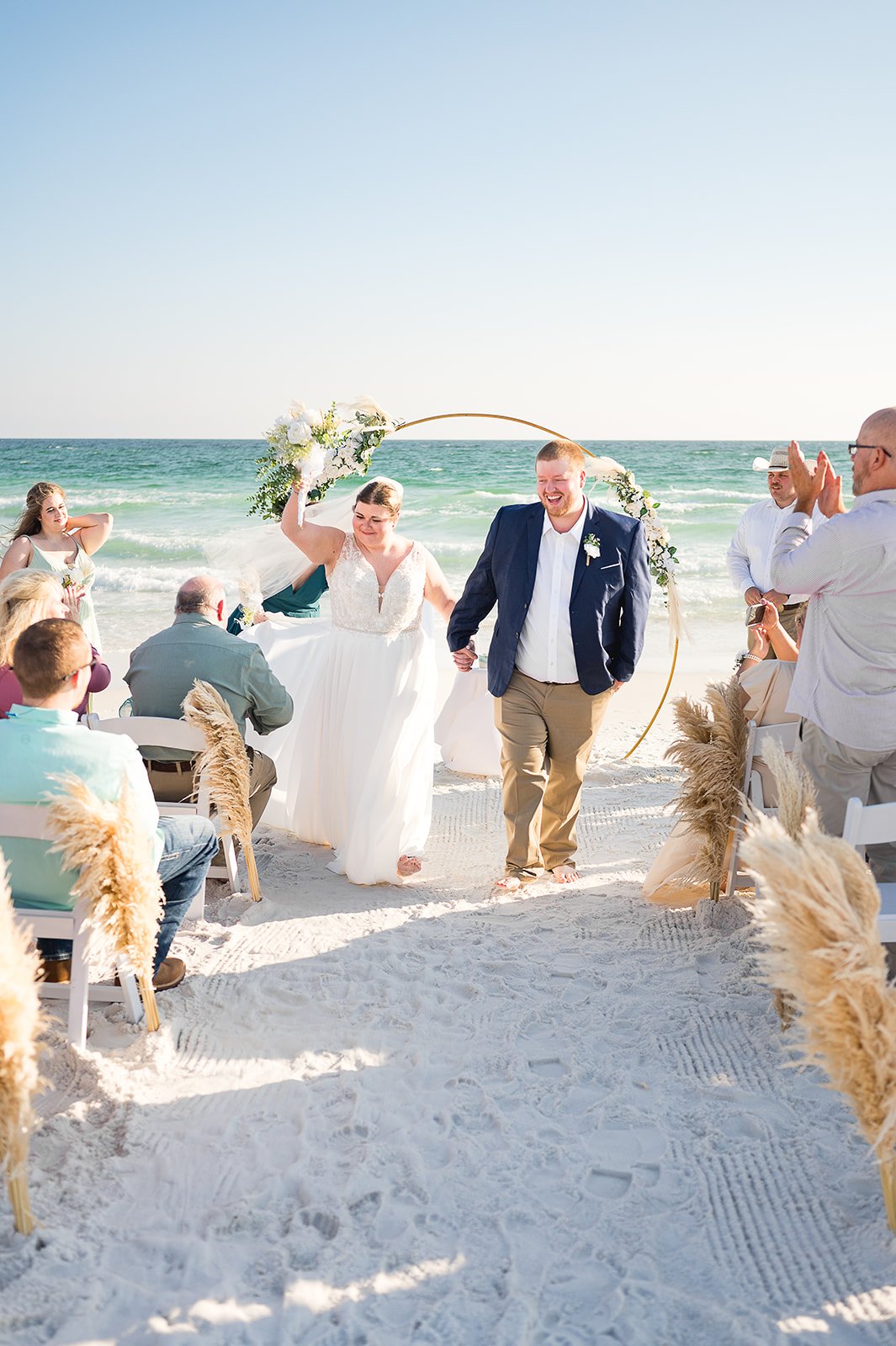 Couple getting married during a sunset ceremony on 30A Beach, Florida