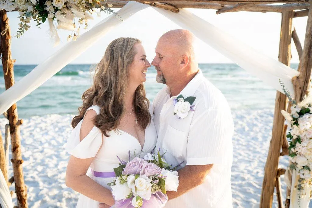 Couple renewing vows during a sunset ceremony on 30A Beach, Florida