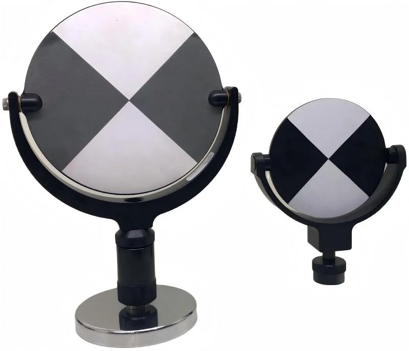 Two camera viewfinders with black and white divided circular screens, mounted on black stands against a white background.