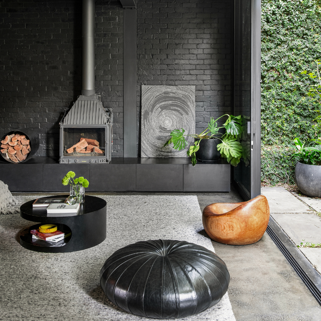 Partially styled living room at 53 Little Smith Street, Fitzroy, featuring a statement fireplace