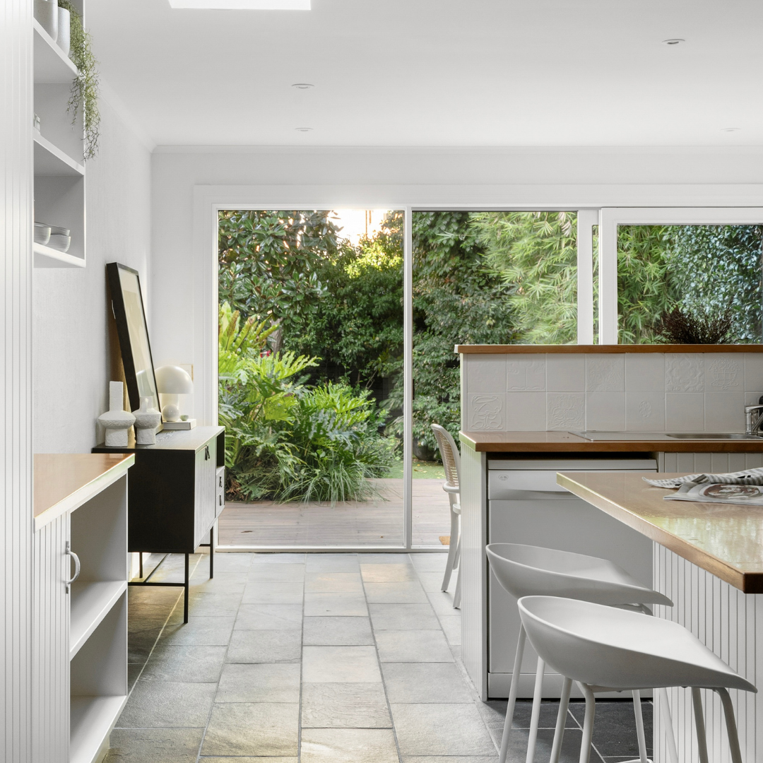 Home staging rear living and dining area in a Fitzroy terrace showcasing indoor–outdoor flow