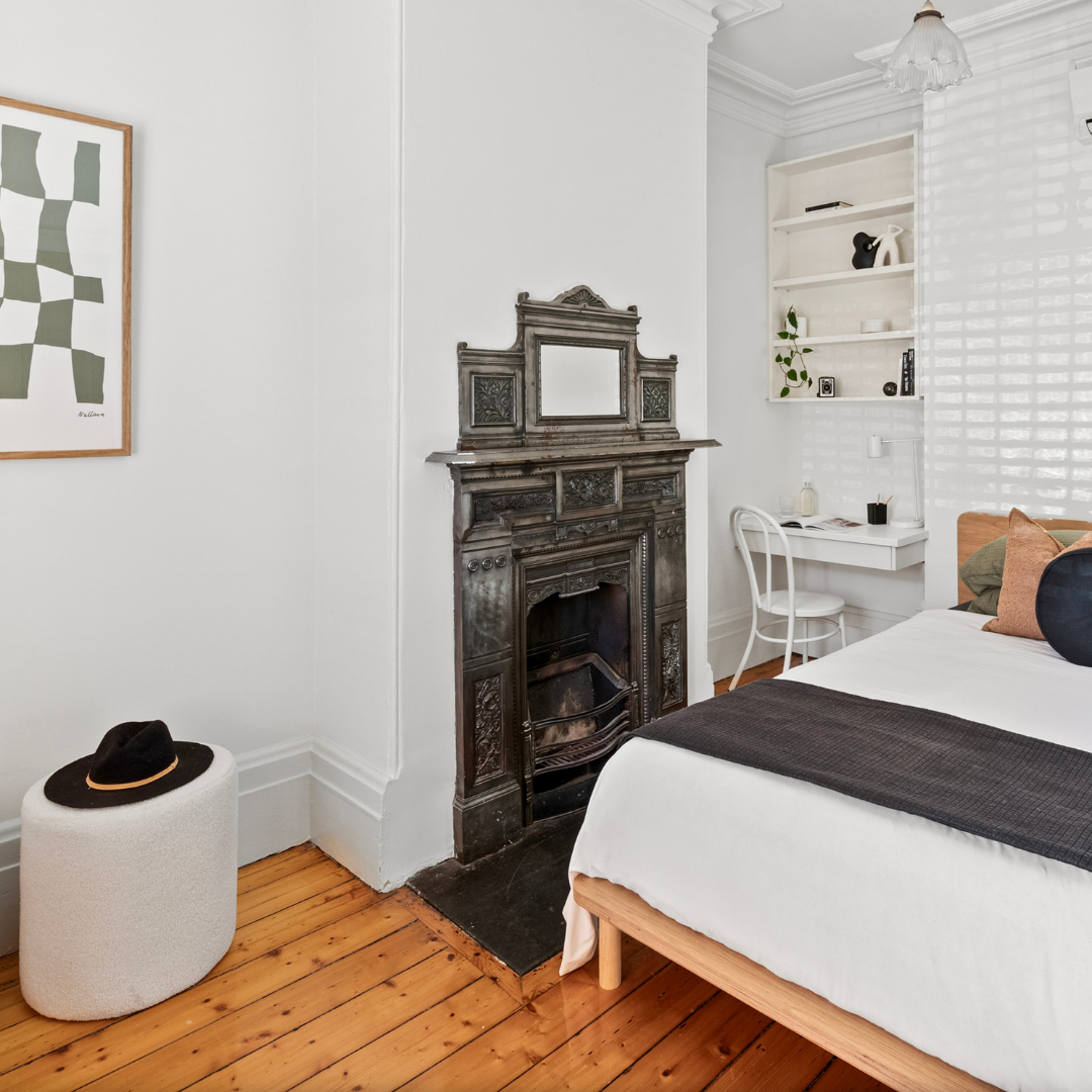Home staging bedroom in a Fitzroy terrace home highlighting original fireplace and heritage details
