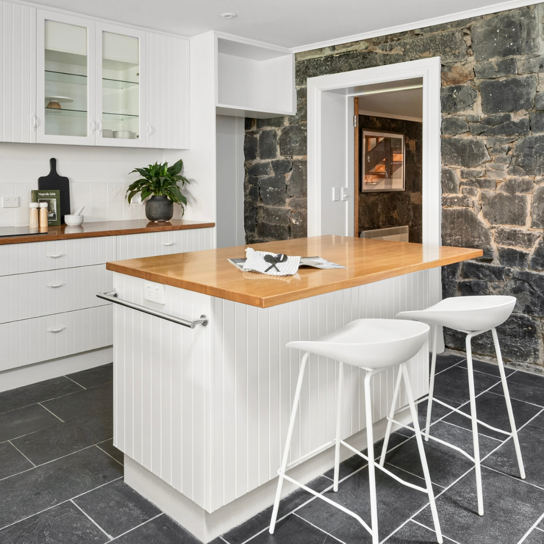 Home staged kitchen in a Fitzroy terrace featuring island seating and contemporary finishes