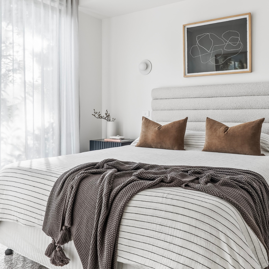 Home staging of a master bedroom with neutral tones designed to attract buyers