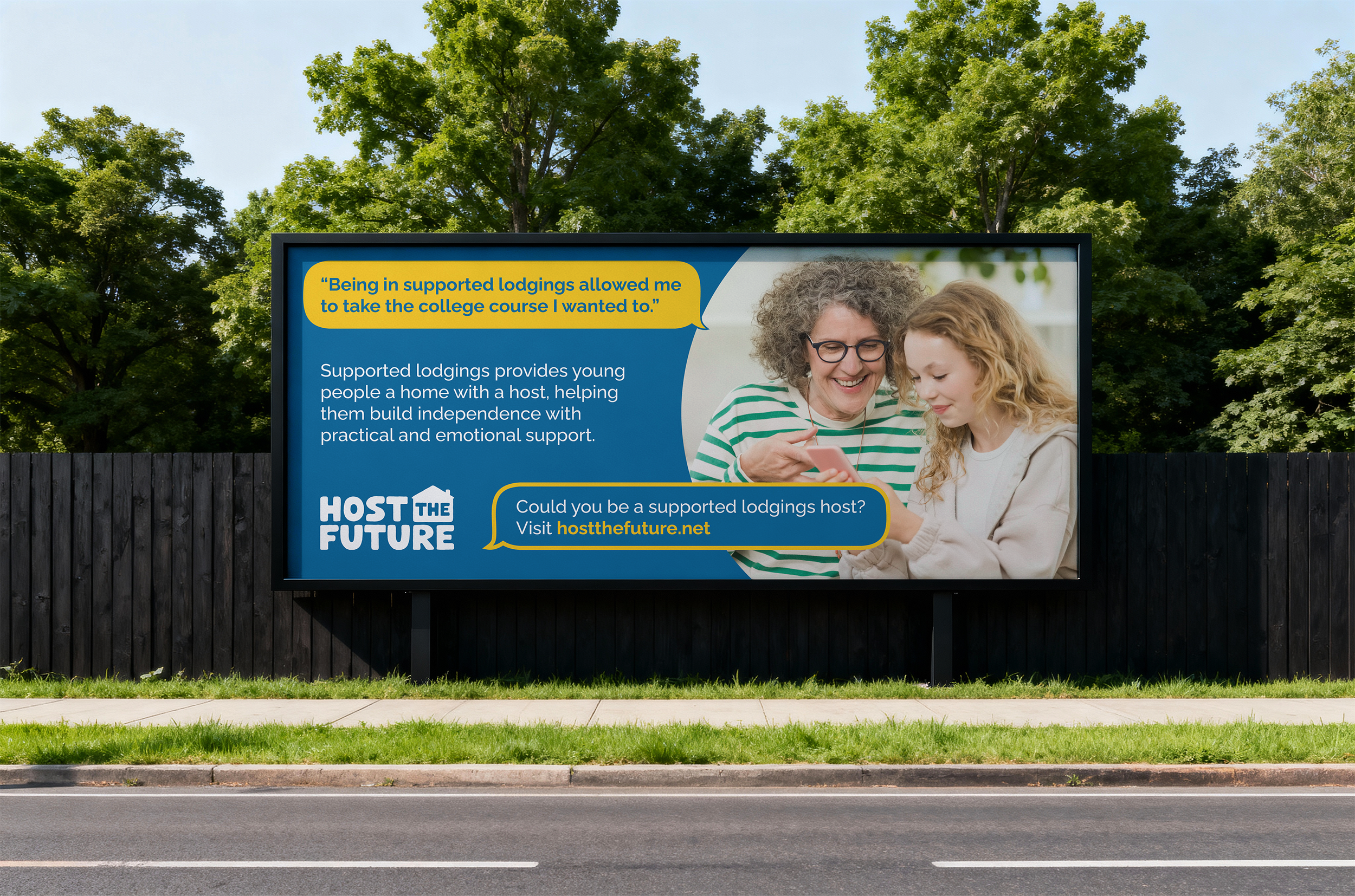 Billboard promoting supported lodgings, showing an older woman and a young girl smiling at a smartphone, with text about supporting young people's independence, encouraging hosts to visit hostthefuture.net.