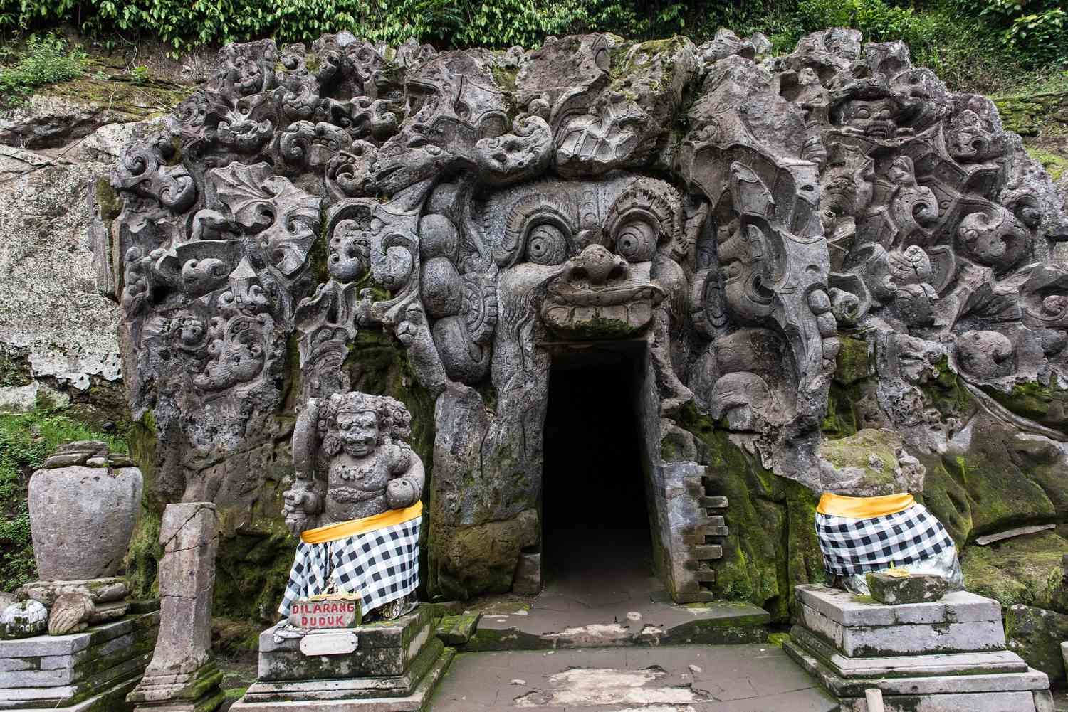 Entrance to Goa Gajah, an ancient cave with intricate carvings, Bali, Indonesia.