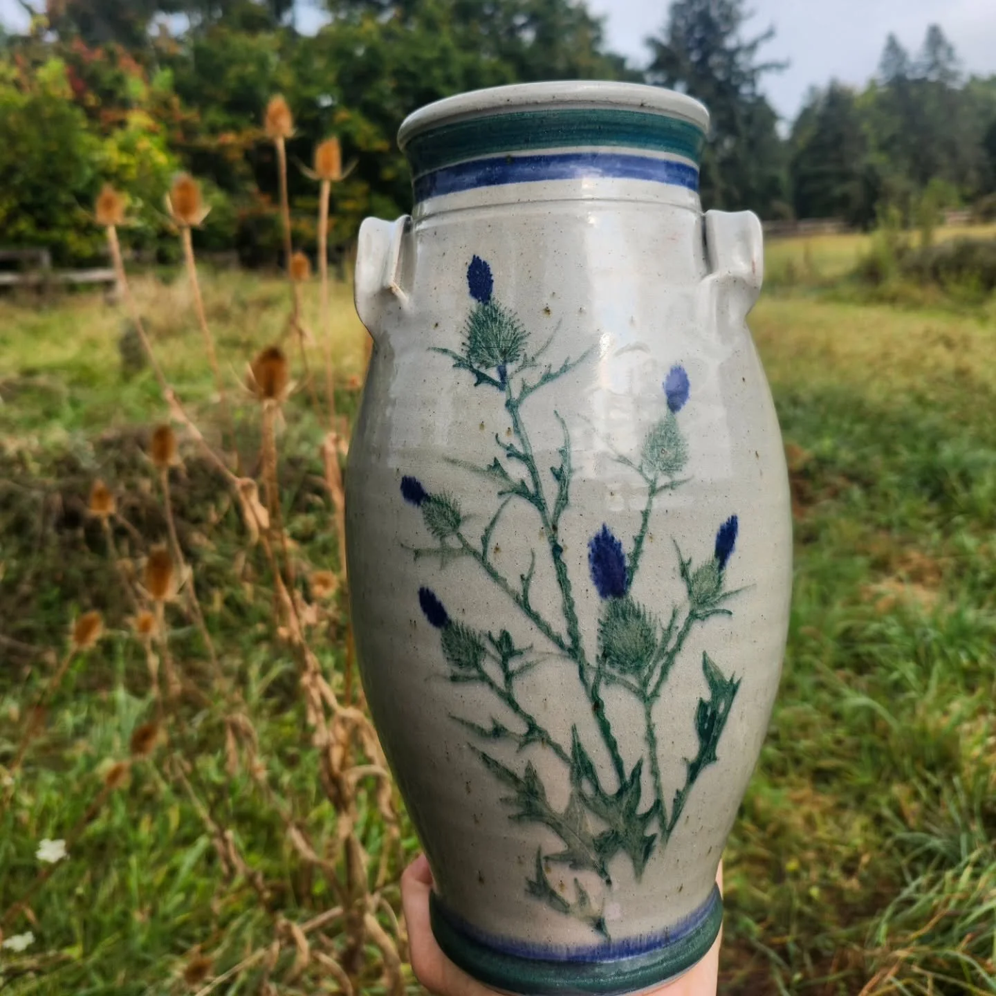 Wild, wonderful Westerwald! This beautiful thistle decor was painted by our gifted artist Dawn, and is pictured here with its inspiration.
Stop in until 4pm today to shop one of a kind pieces like this, and continue enjoying 25% off fall items in s