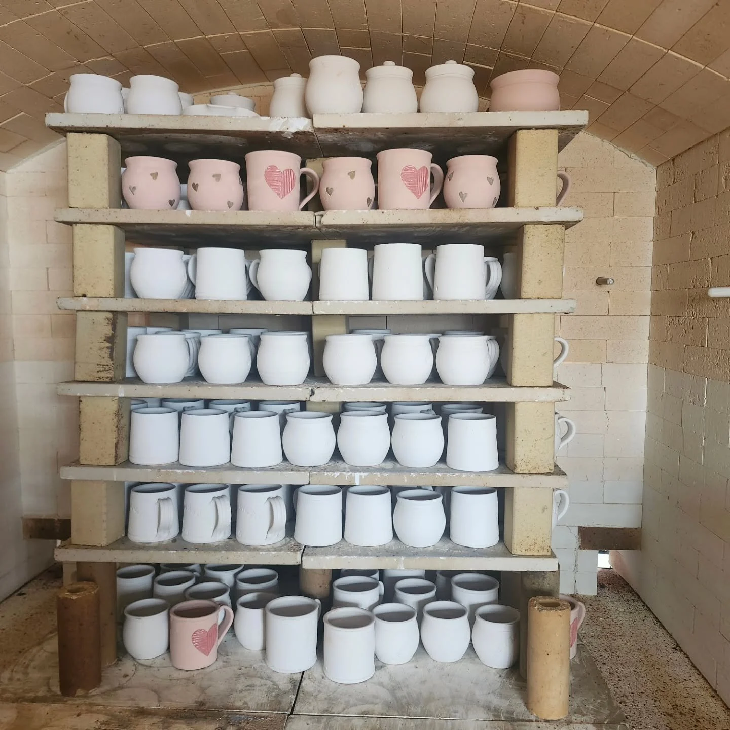Sneak peek of the heart mugs firing in our kiln today. We are thrilled to be back to be firing after last week's terrible weather.  If all goes well these will be stocked in person and on the website on Friday.

#sceneryhill #valentinesgift #heartmug