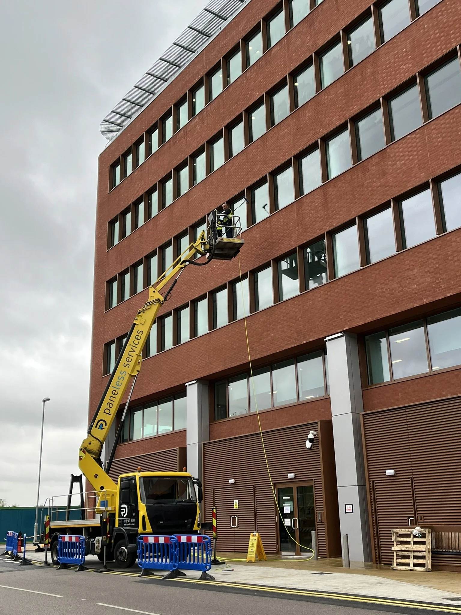 Window cleaning using a truckmounted cherrypicker (MEWP)