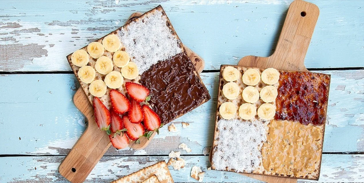 two pieces of matzah with sweet toppings
