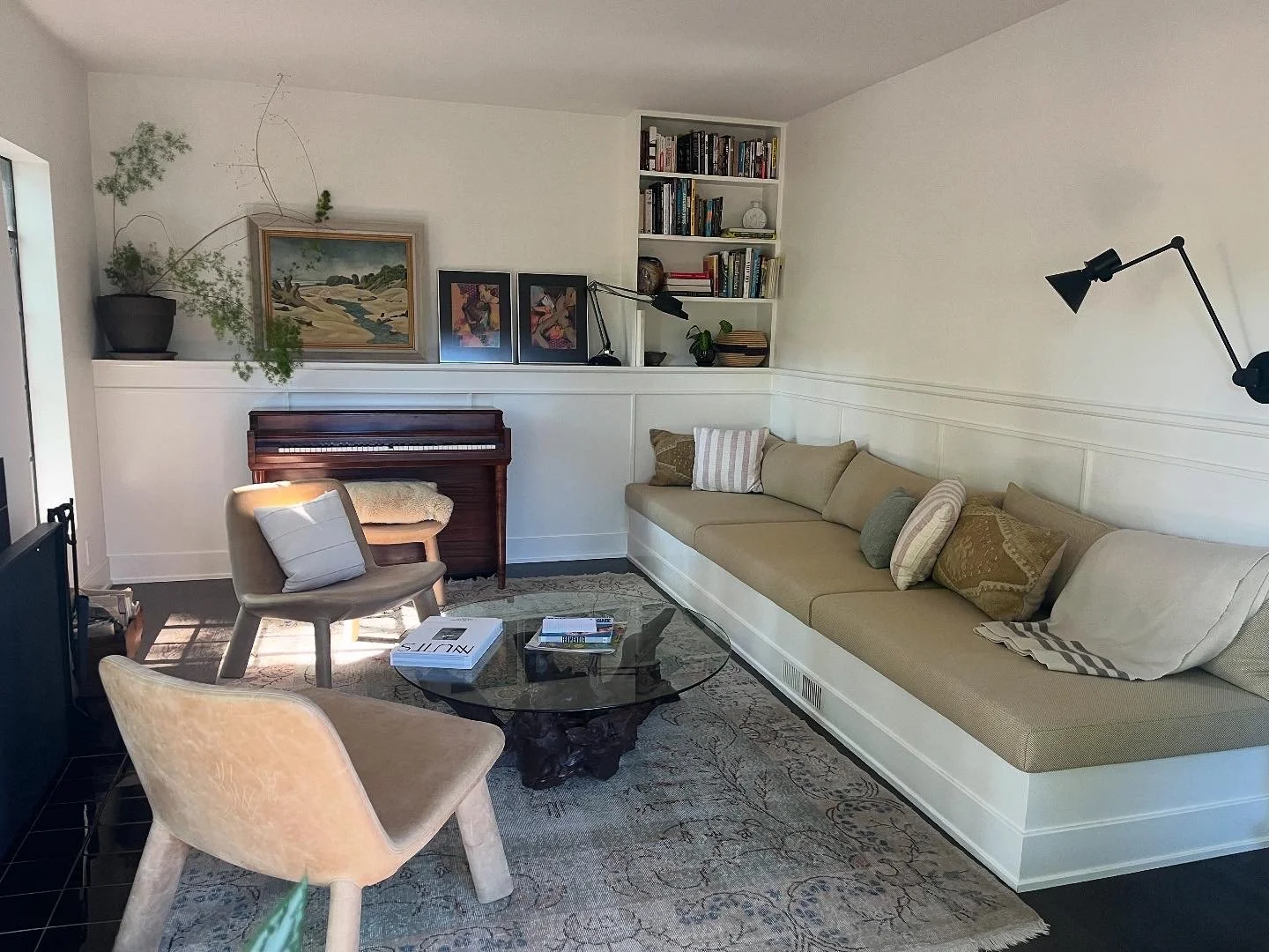 This living room got the works! We bumped out the back wall to add some depth to the room and to create a shelf for art and plants. Then we added a bookshelf and built in sofa. Trimmed everything and left it for the clients to enjoy. 
Design by: Cope