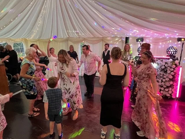A busy dance floor with the deluxe flower DJ booth set up in Pakefield, Suffolk