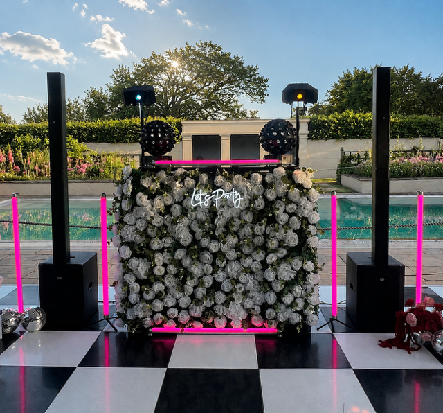 The deluxe flower booth DJ set up at Henstead Pavilion. Black and white dance floor. Equinox DJ booth. Maui LD 28G3. Gorilla Pixel sticks