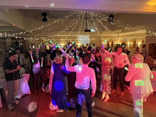 Wedding party. Busy dance floor at Waveney House Hotel in Beccles. Glowsticks