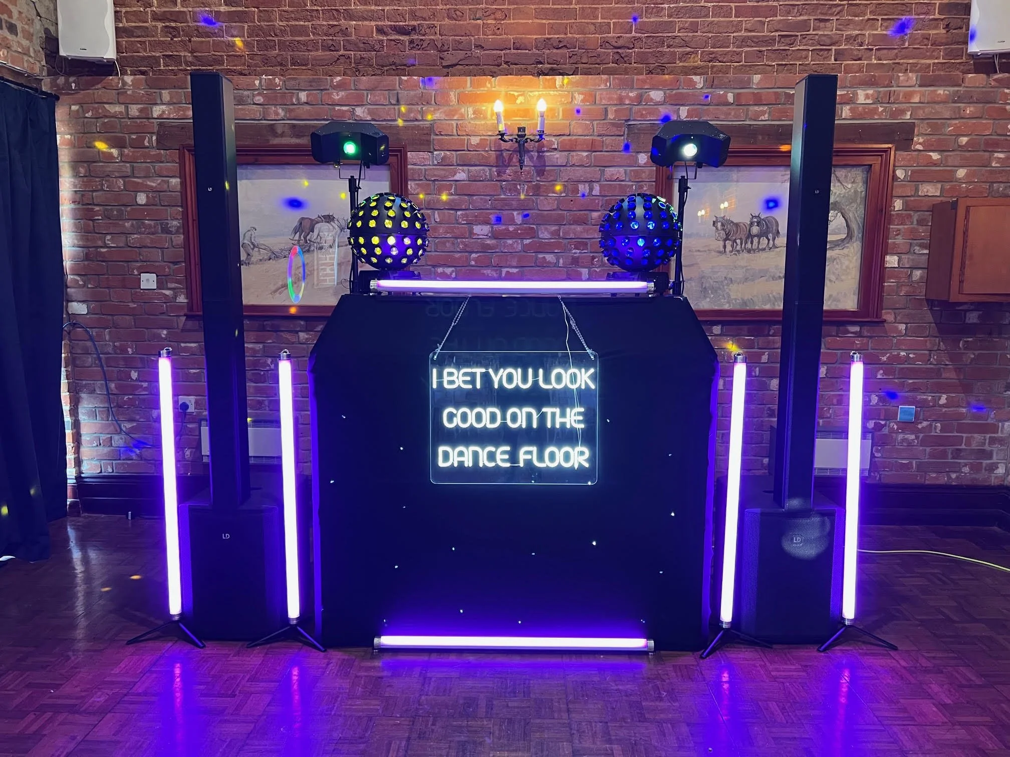 Party DJ. Black stars set up with yellow and blue them for a Prom at Parkhill Suffolk 