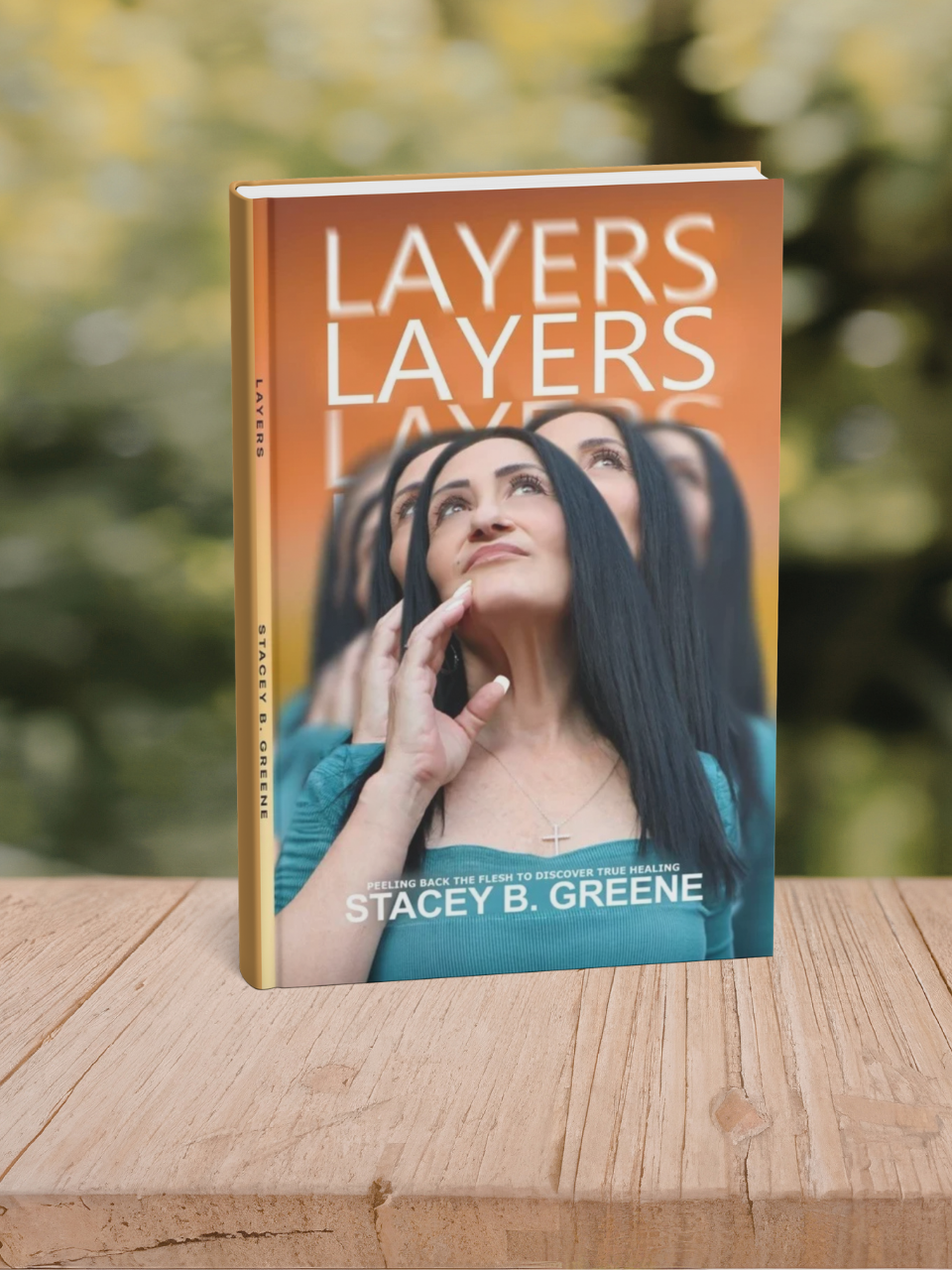 Book titled "Layers" by Stacey B. Greene with a cover photo of a woman with long dark hair, looking thoughtful, outdoors background.
