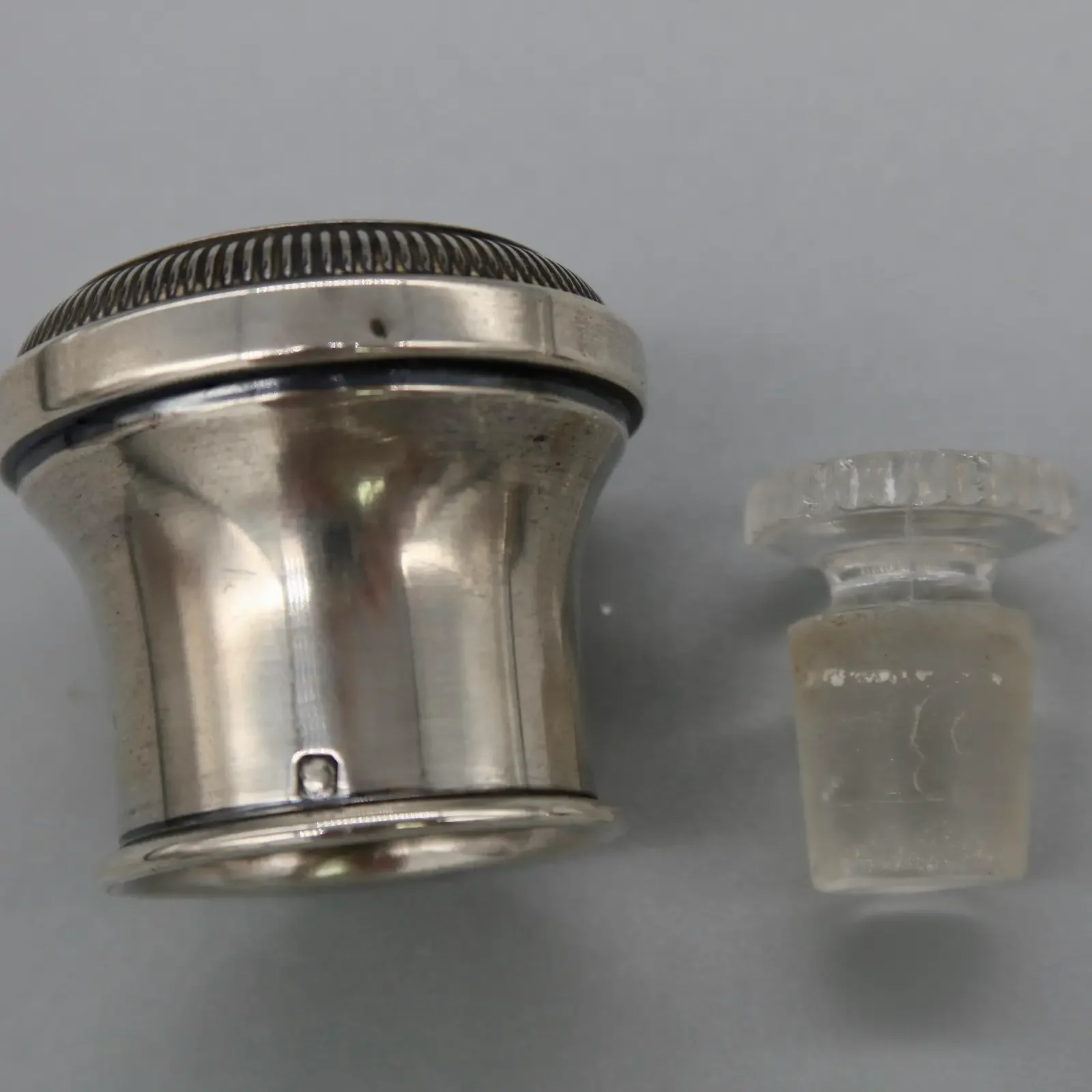 pair-of-antique-crystal-scent-bottles-with-silver-mounts-engraved-monogram-hallmarked-silver-1970.webp