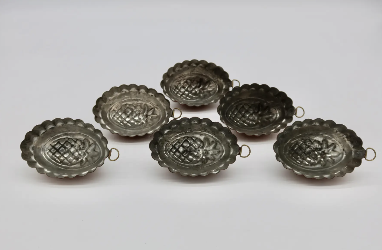 Set of early 1920's French copper molds. They are tin lined, each with its original hanger. Located in Austin, Texas.