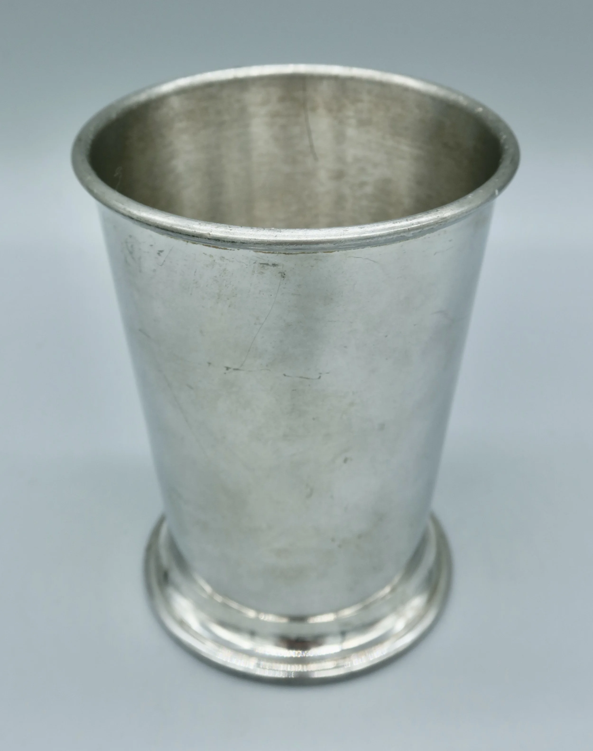Commemorative mint julep cup from Churchill Downs, 2000, Woodford Reserve branding. Crafted in pewter, this cup is a collectible piece of Kentucky Derby memorabilia. Located in Austin, Texas.