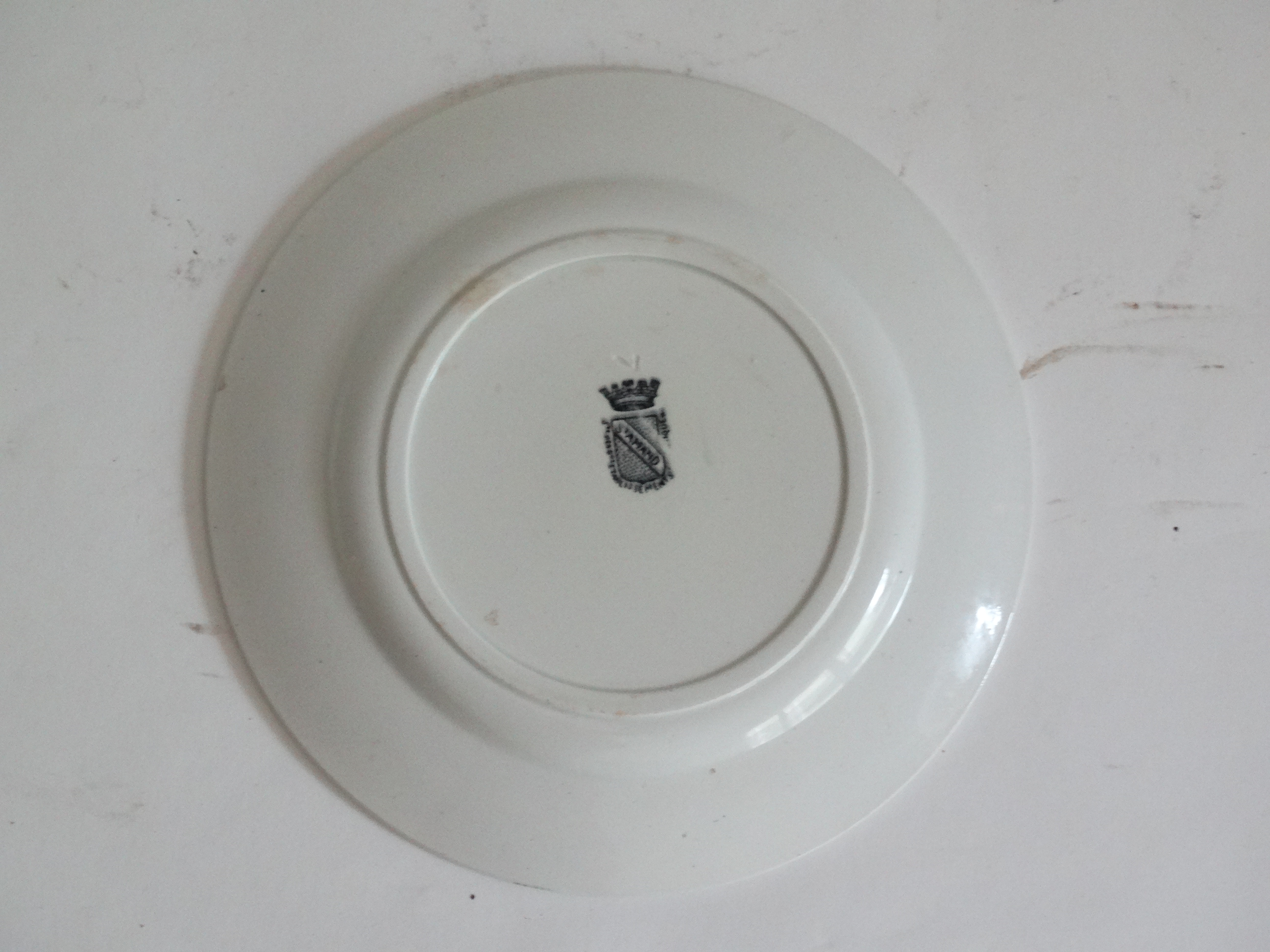 Four French faience sporting plates from St Amand factory, circa 1920. Includes Le Tennis, La Course Pied, La Boxe, L’Aviation, and l'Automobilisme. Located in Austin, Texas.