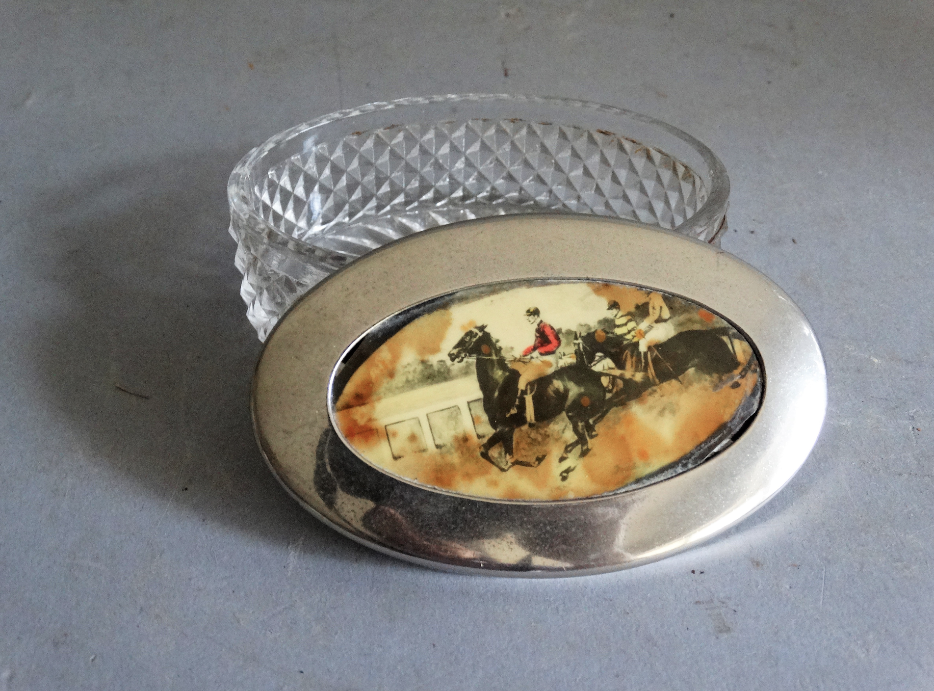 An early 20th-century English crystal and silver-plate box with an equestrian scene. Located in Austin, Texas.