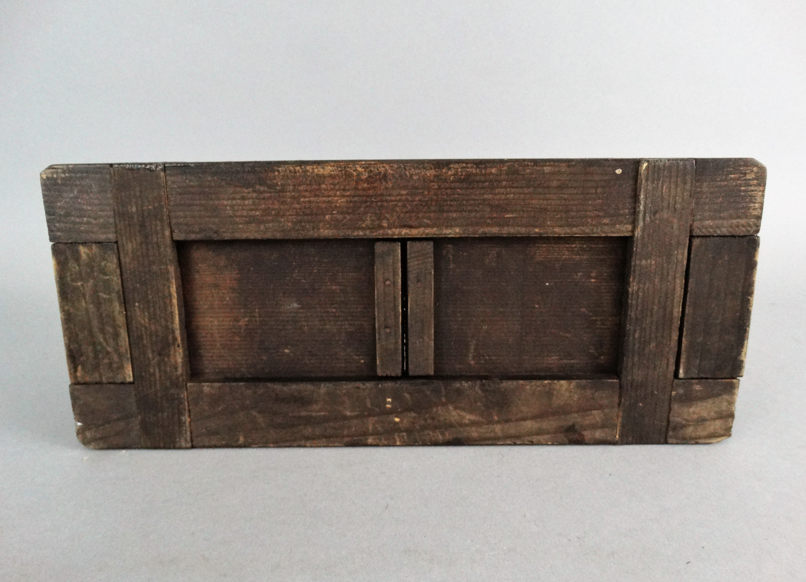 An early 20th-century carved telescoping Black Forest book slide. It has carved palm trees on both ends. Located in Austin, Texas.