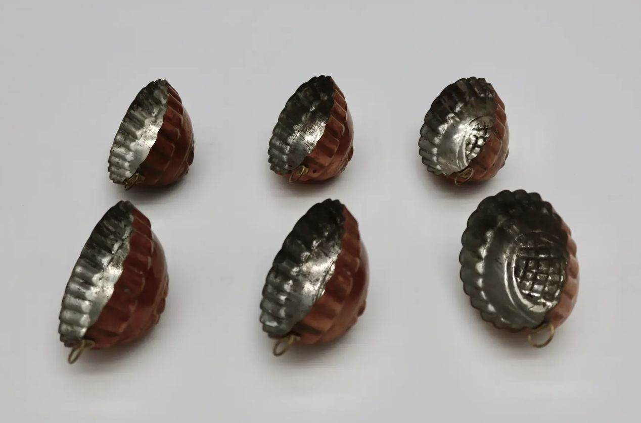 Set of early 1920's French copper molds. They are tin lined, each with its original hanger. Located in Austin, Texas.