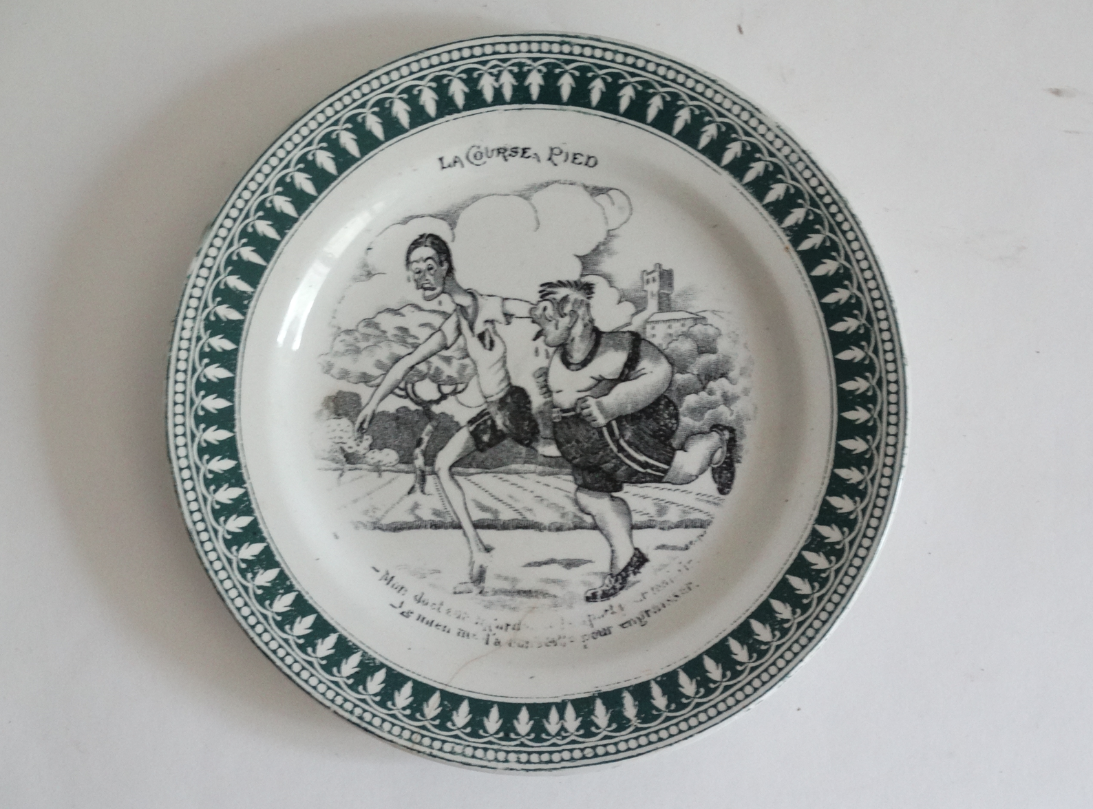 Four French faience sporting plates from St Amand factory, circa 1920. Includes Le Tennis, La Course Pied, La Boxe, L’Aviation, and l'Automobilisme. Located in Austin, Texas.