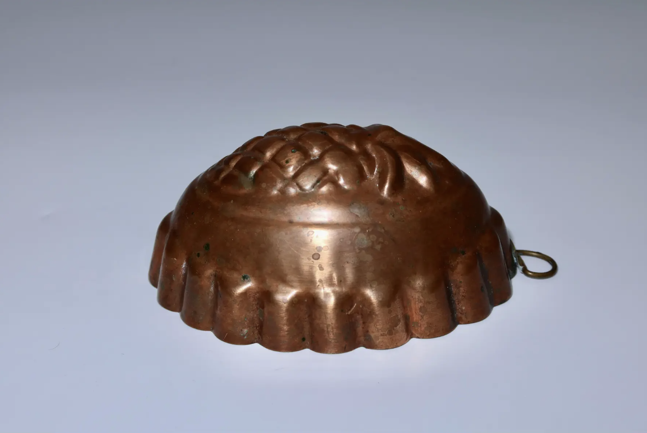 Set of early 1920's French copper molds. They are tin lined, each with its original hanger. Located in Austin, Texas.