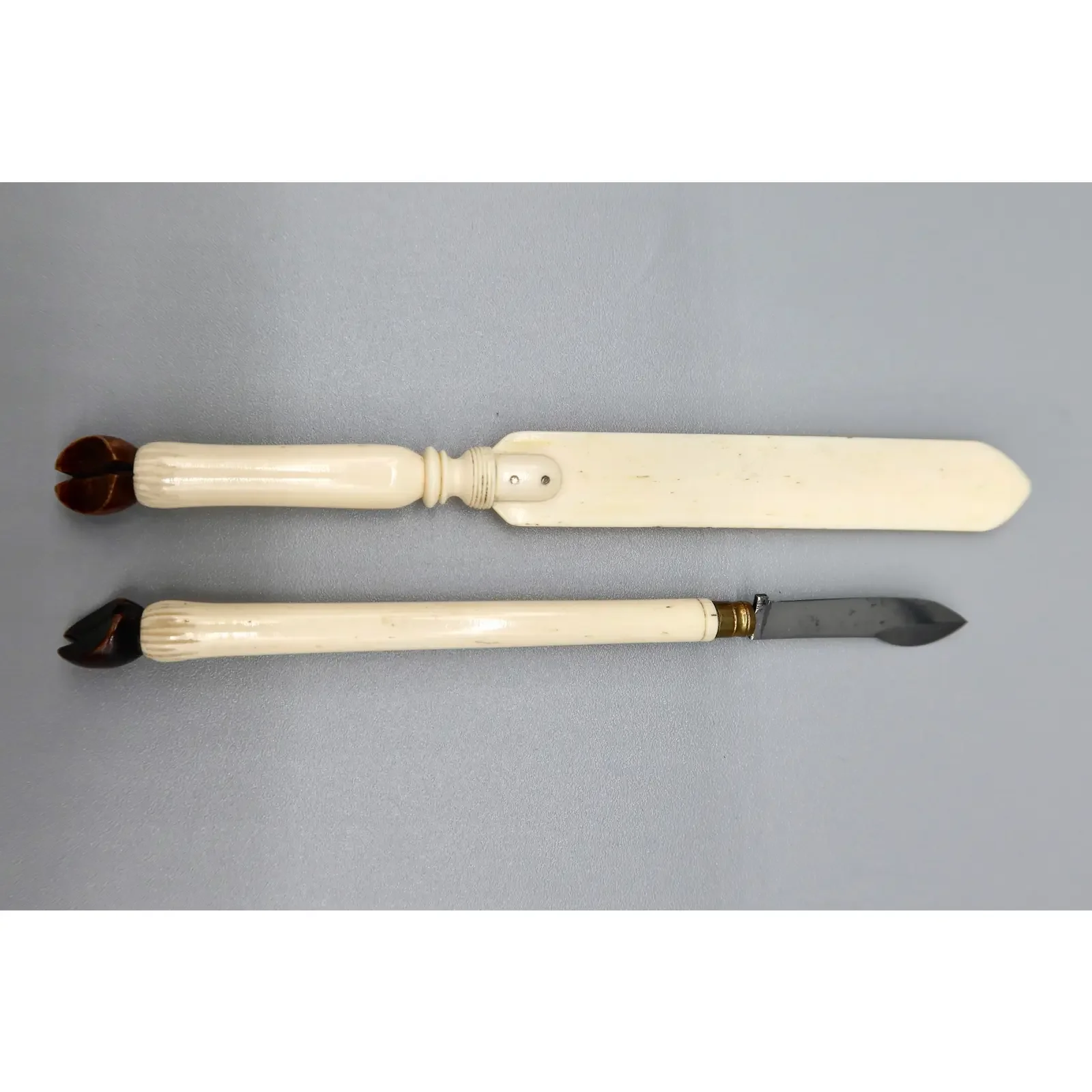 pair-of-antique-bone-letter-openers-with-hoof-form-handles-c-1900-1972.webp