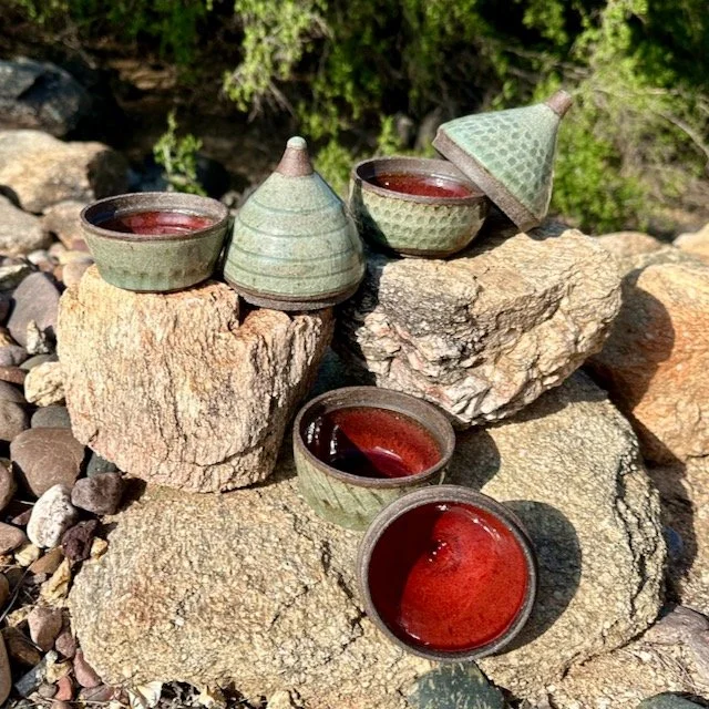 3 pointy lidded jars, tops off, red interior